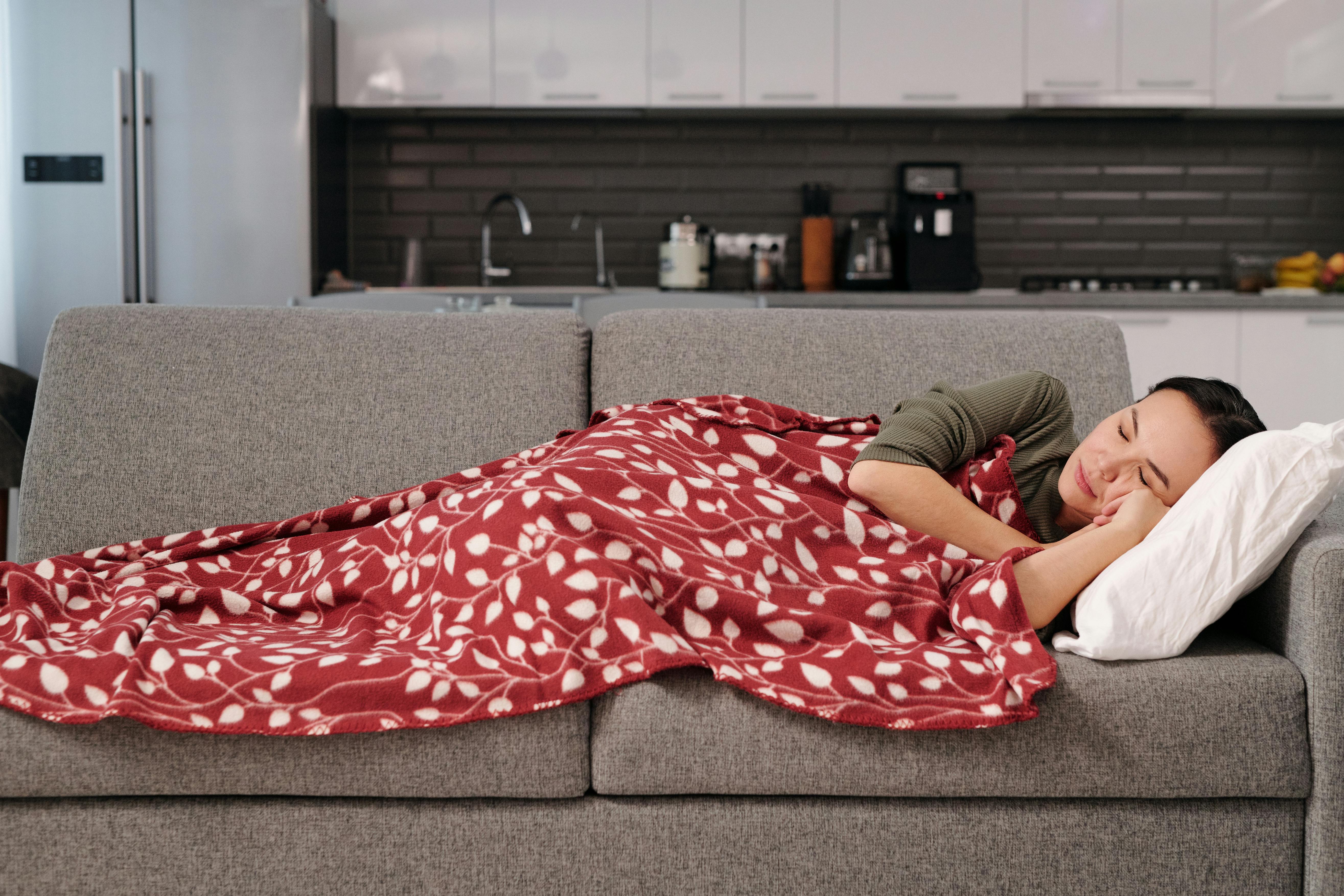 A woman sleeping on a sofa | Source: Pexels