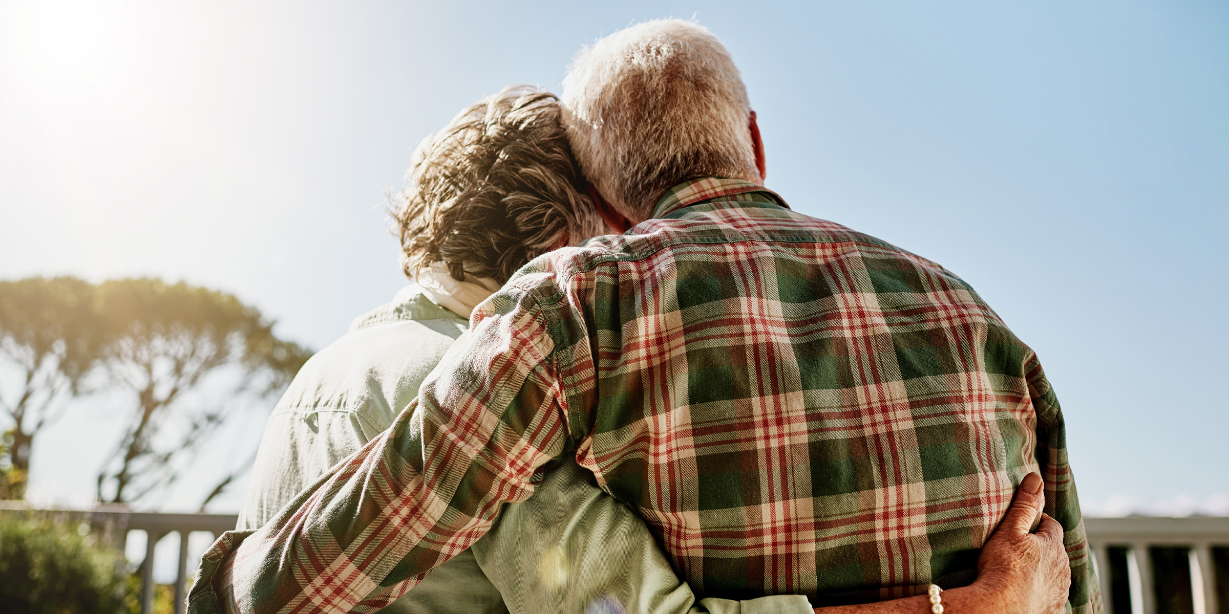 An elderly couple hugging each other | Source: Shutterstock