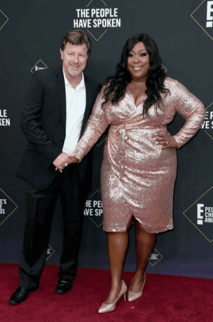 James Welsh and Loni Love pose on the red carpet for the 2019 E! People's Choice Awards, on November 10, 2019, in Santa Monica, California | Source: Frazer Harrison/Getty Images