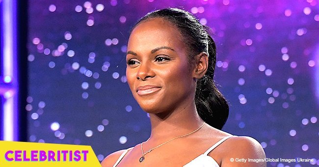 Tika Sumpter teases with her decolletage in revealing orange dress in recent pic