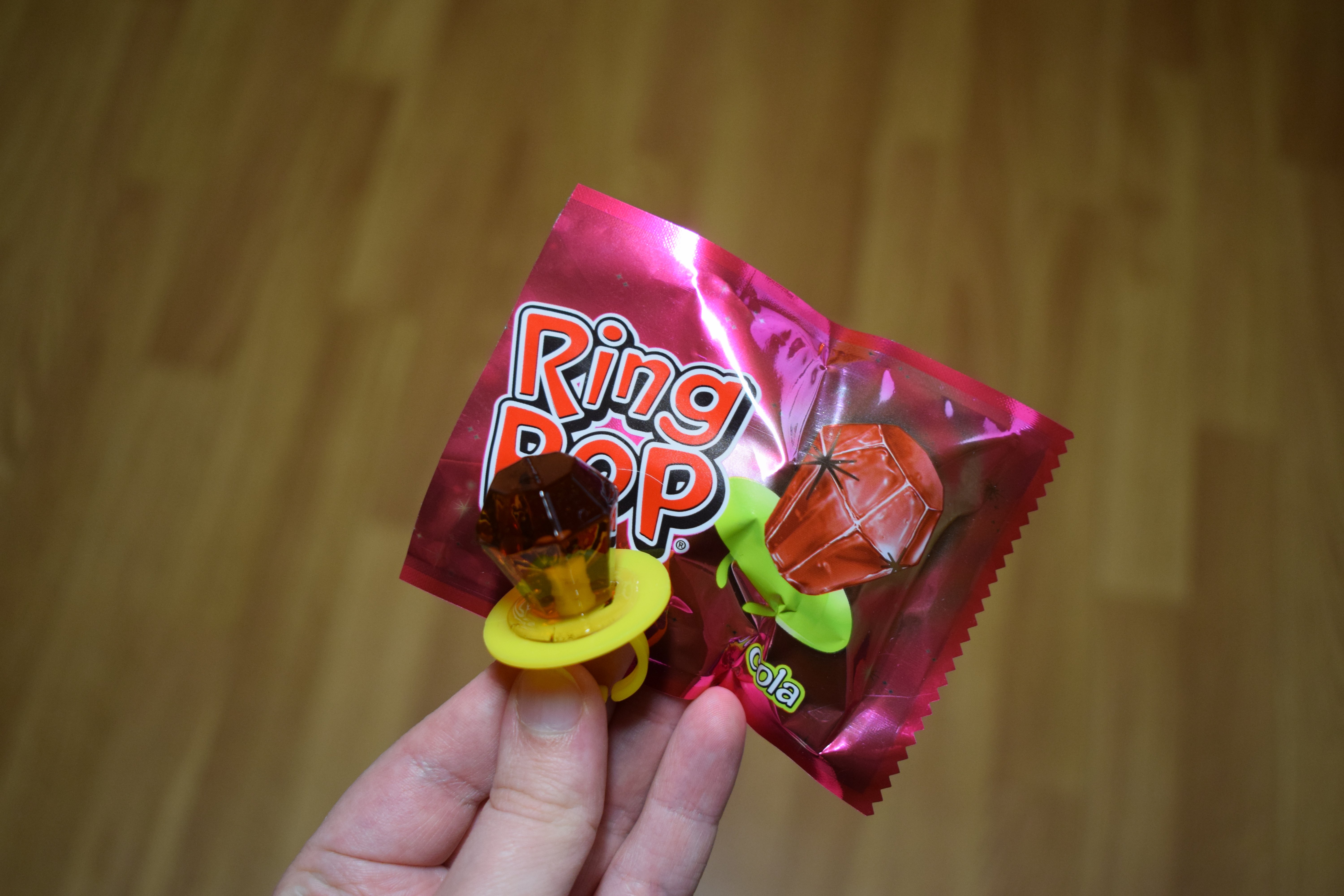Ring Pop Cola candy product | Source: Shutterstock/SiljeAO