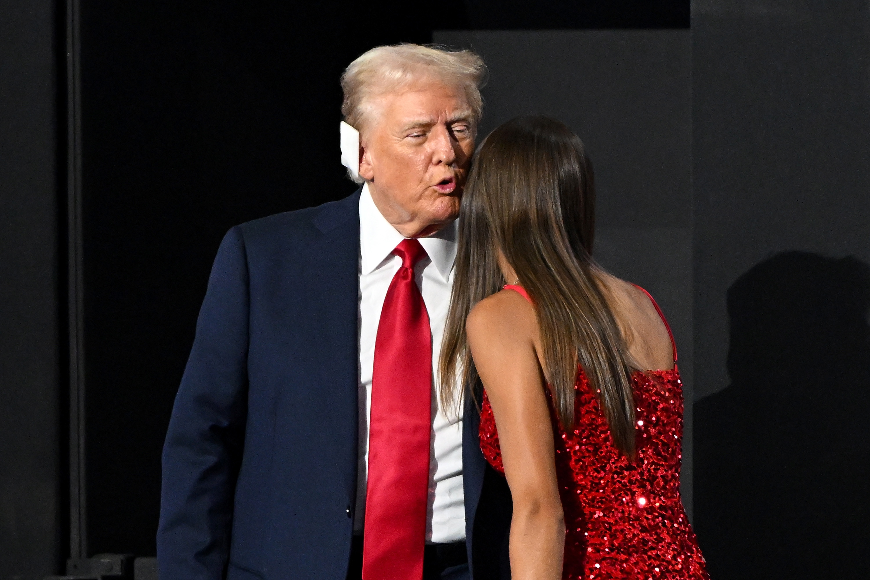 President Donald Trump greets daughter of Donald Trump Jr., Kai Trump, on the fourth day of the Republican National Convention at the Fiserv Forum on July 18, 2024, in Milwaukee, Wisconsin | Source: Getty Images