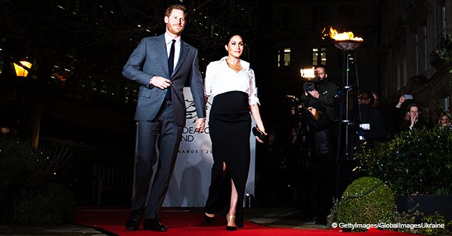 Pregnant Meghan Markle flashes legs through a deep slit, strolls hand-in-hand with Prince Harry