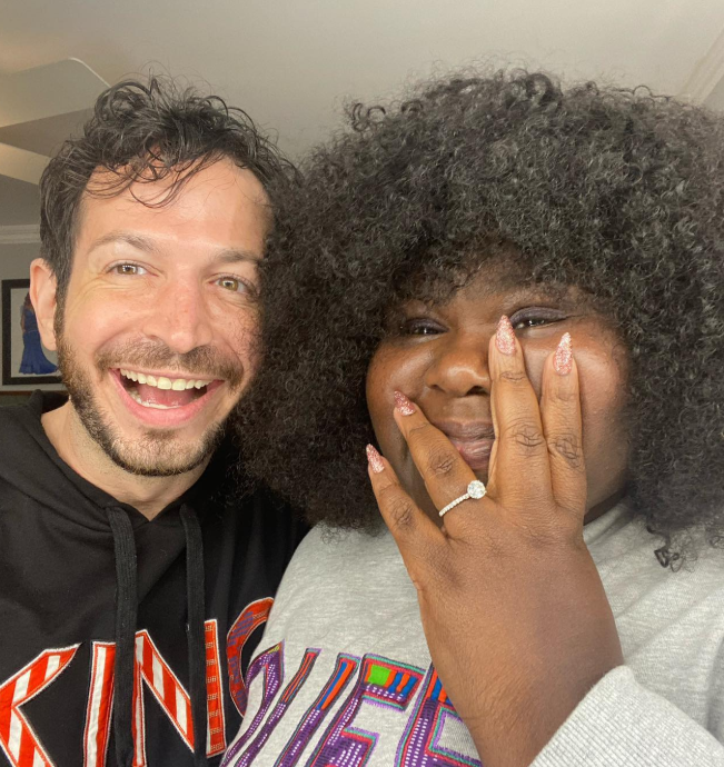 Gabourey Sidibe and Brandon Frankel share a joyful moment, showing off her engagement ring | Source: Instagram/brandontour
