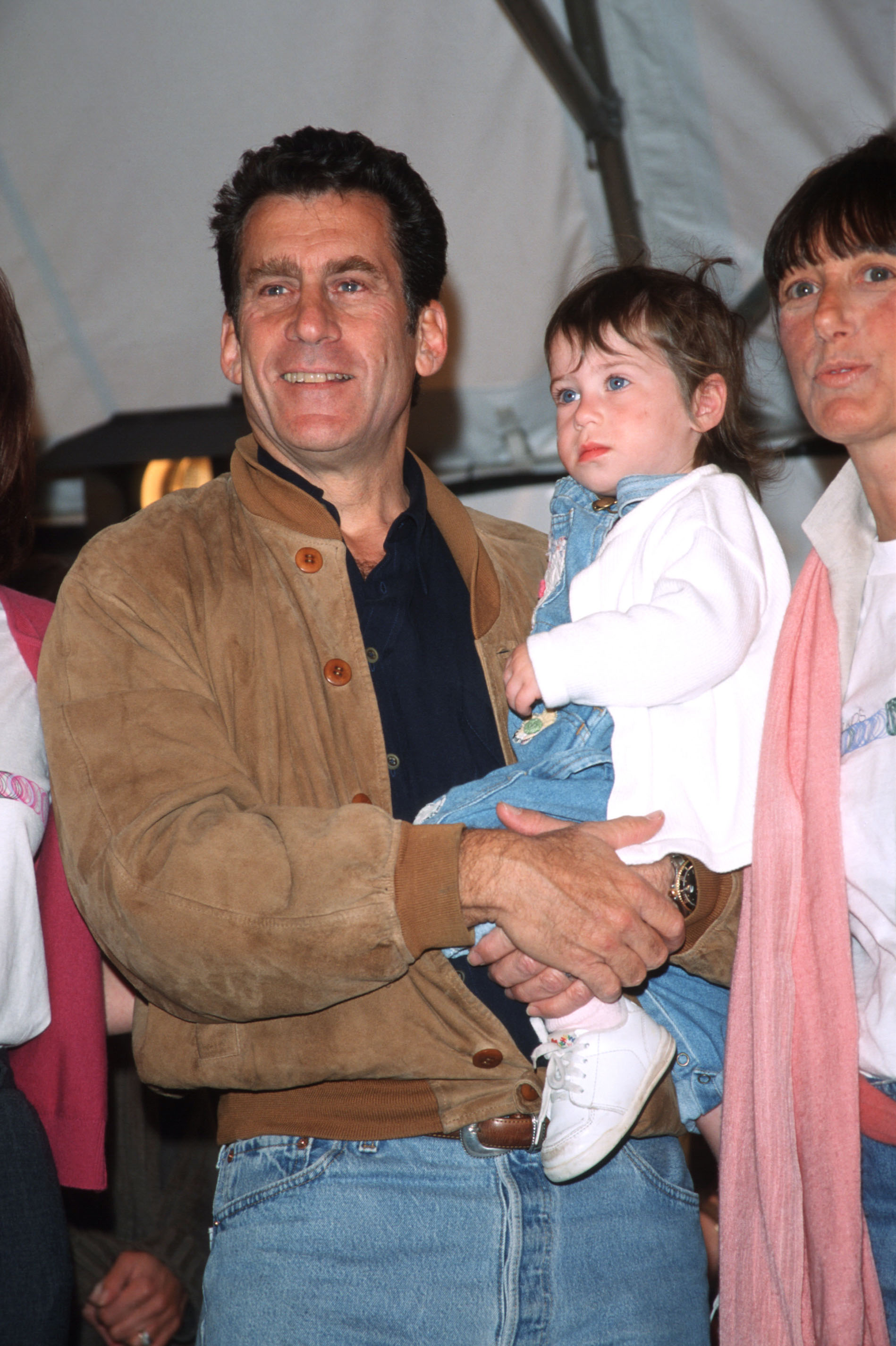 Paul Michael Glaser pictured holding daughter Zoe Glaser at the Kids for Kids AIDS Benefit on April 25, 1999 in New York City. | Source: Getty Images