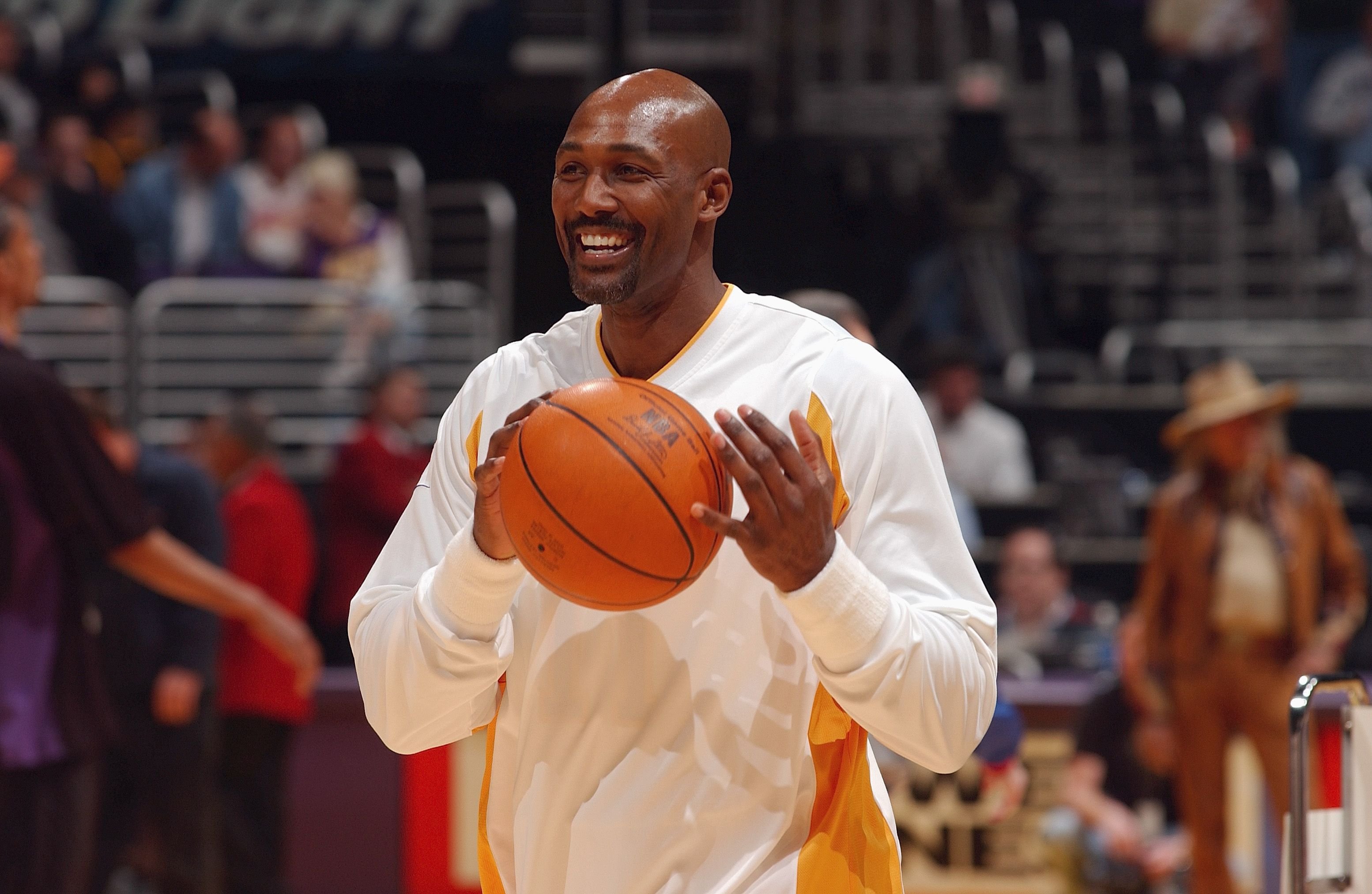 Karl Malone #11 of the Los Angeles Lakers smiles during the game against the Utah Jazz at Staples Center on March 28, 2004 in Los Angeles, California. | Source: Getty Images