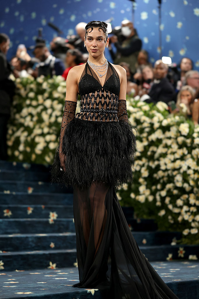 Dua Lipa at the 2025 Met Gala on May 5, held at the Metropolitan Museum of Art in NYC, celebrating "Superfine: Tailoring Black Style."