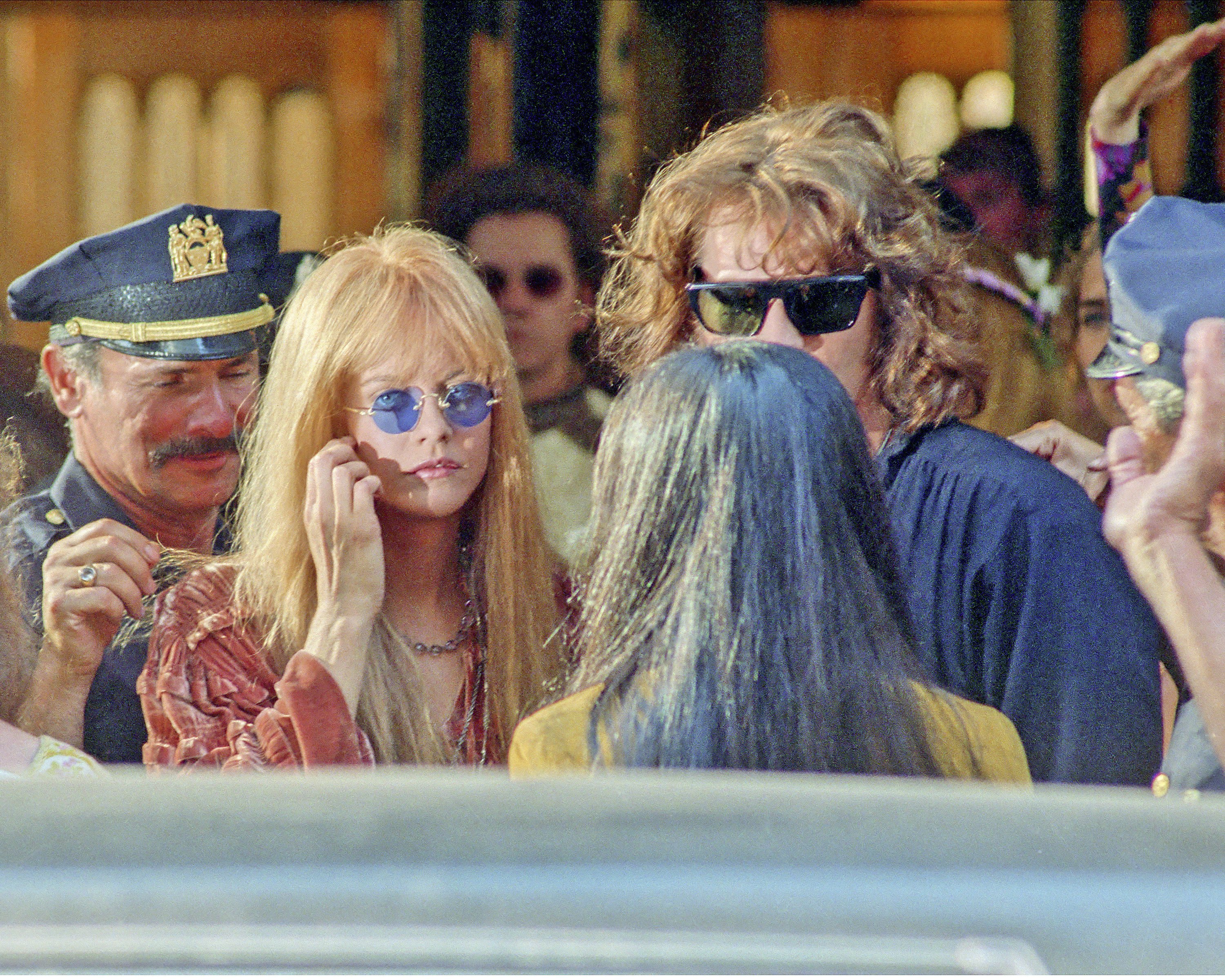 Meg Ryan who plays Pamela Courson, Morrison's companion and Val Kilmer as Jim Morrison who star in movie "The Doors" being filmed in New York. | Source: Getty Images
