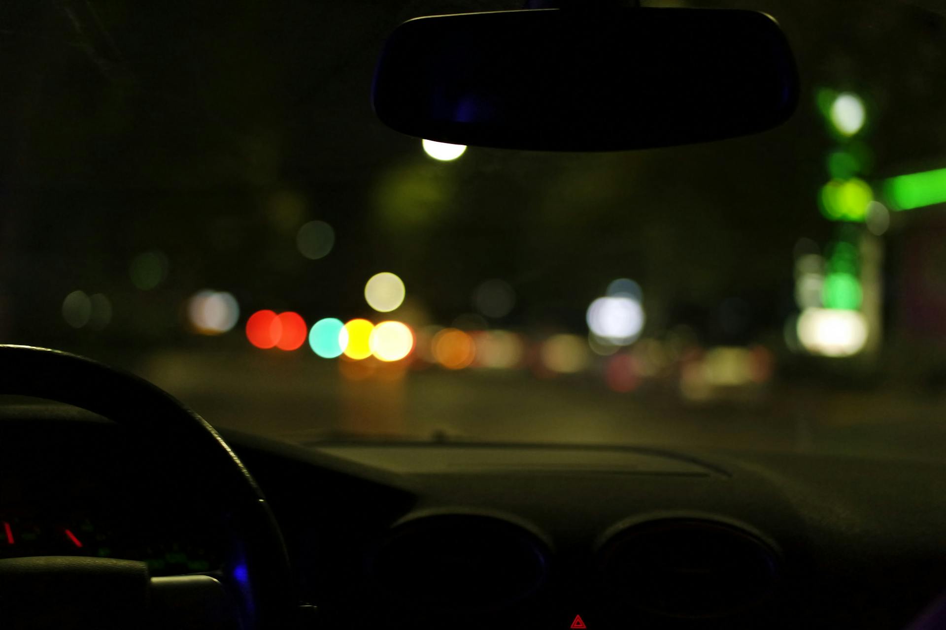 A person driving a car at night | Source: Pexels