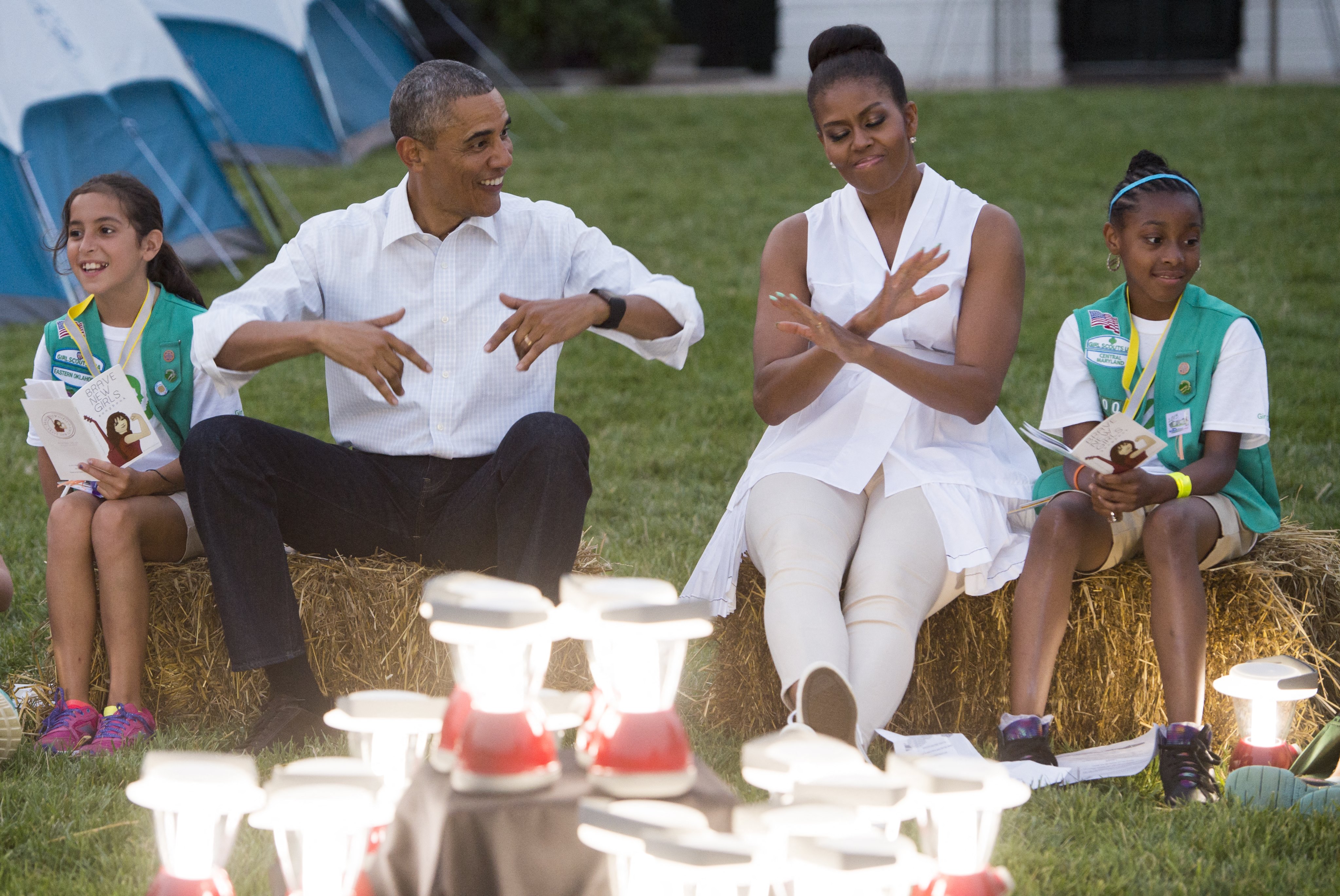 Barack and Michelle Obama showing off their dance moves during their visit with Girl Scouts who camped overnight on the South Lawn of the White House in Washington, D.C, on June 30, 2015. | Source: Getty Images