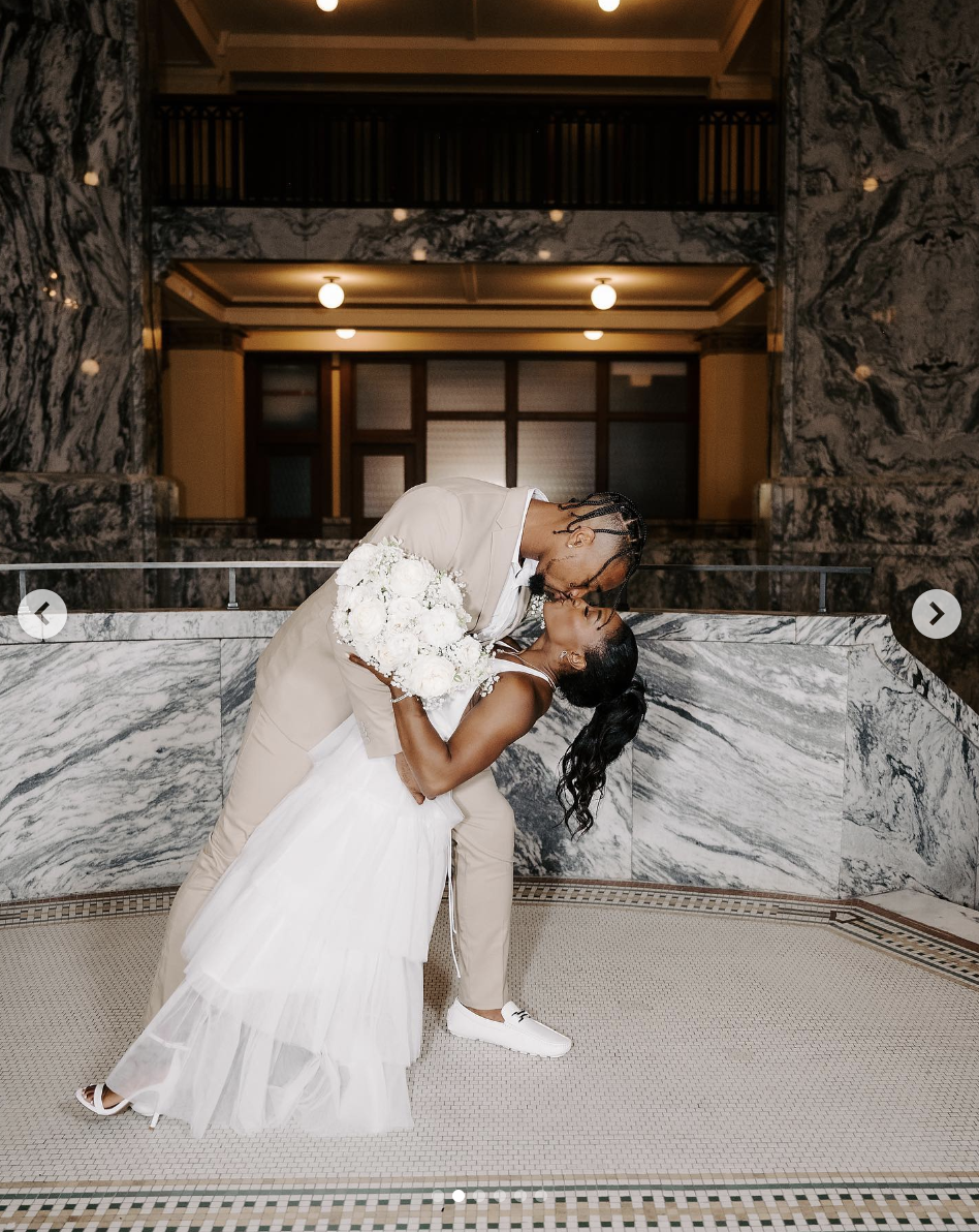 Jonathan Owens kissing Simone Biles on their wedding day, as seen in a post dated April 22, 2023 | Source: Instagram/simonebiles