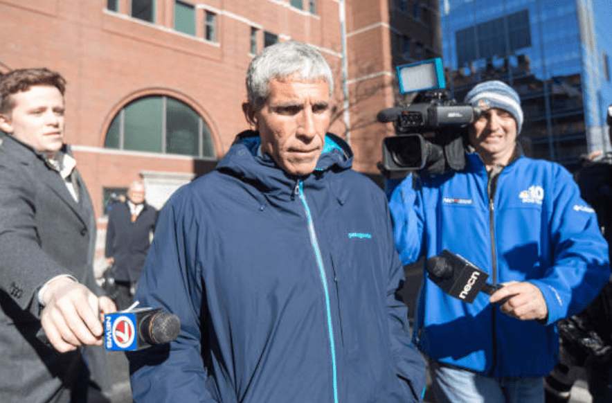 William "Rick" Singer is swarmed by press as her leaves Boston Federal Court after being charged for his role in the college admissions scandal on March 12, 2019 in Boston, Massachusetts | Source: Scott Eisen/Getty Images