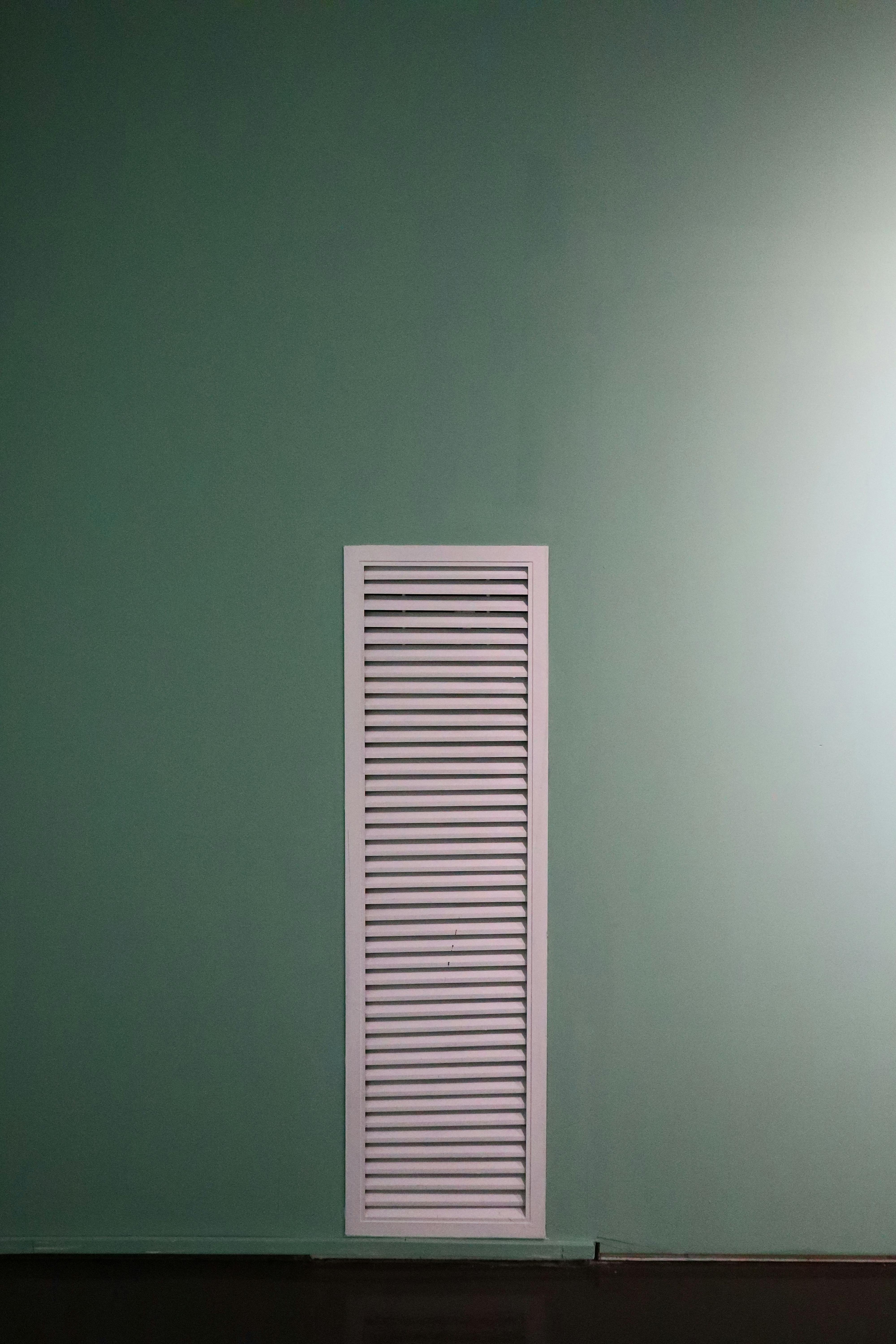 An air vent on a wall highlights how dust and allergens can quietly circulate through the home. | Source: Pexels