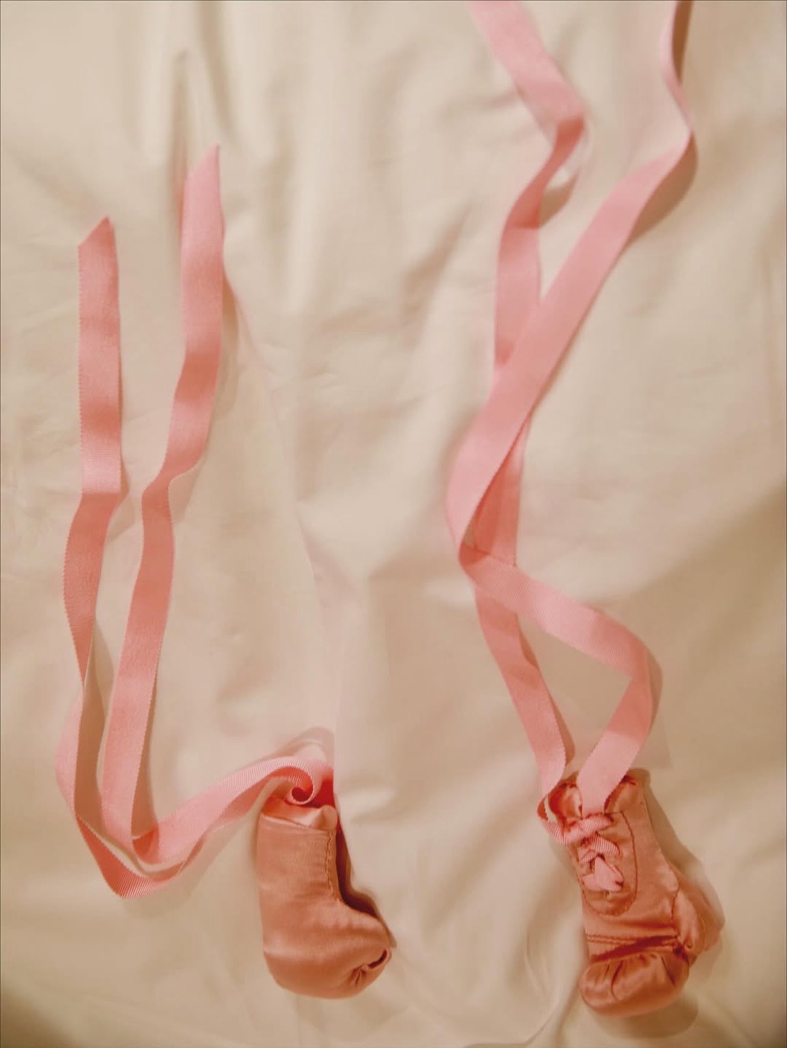 Rihanna shares a picture of tiny pink boxing gloves, from a post dated September 25, 2025 | Source: X/rihanna