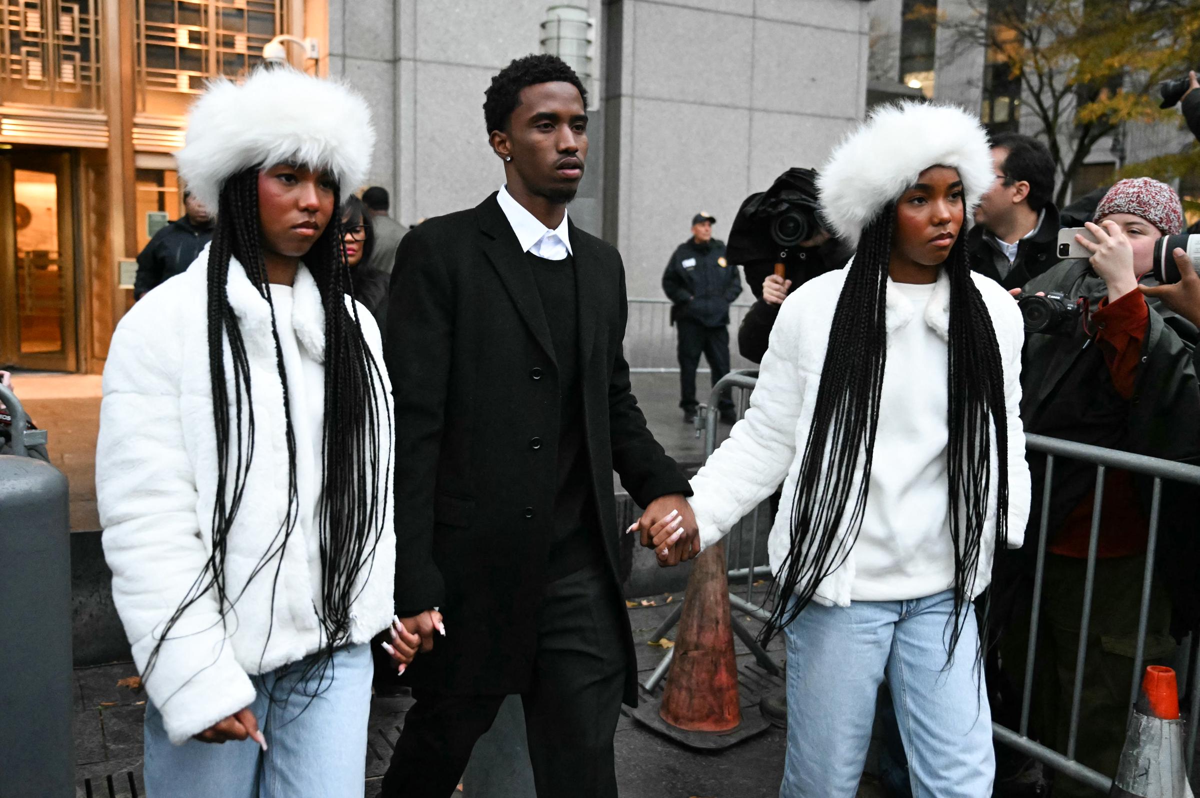 Jessie, Christian, and D'Lila Combs hold hands as they leave the federal court on November 22, 2024, in New York City. | Source: Getty Images