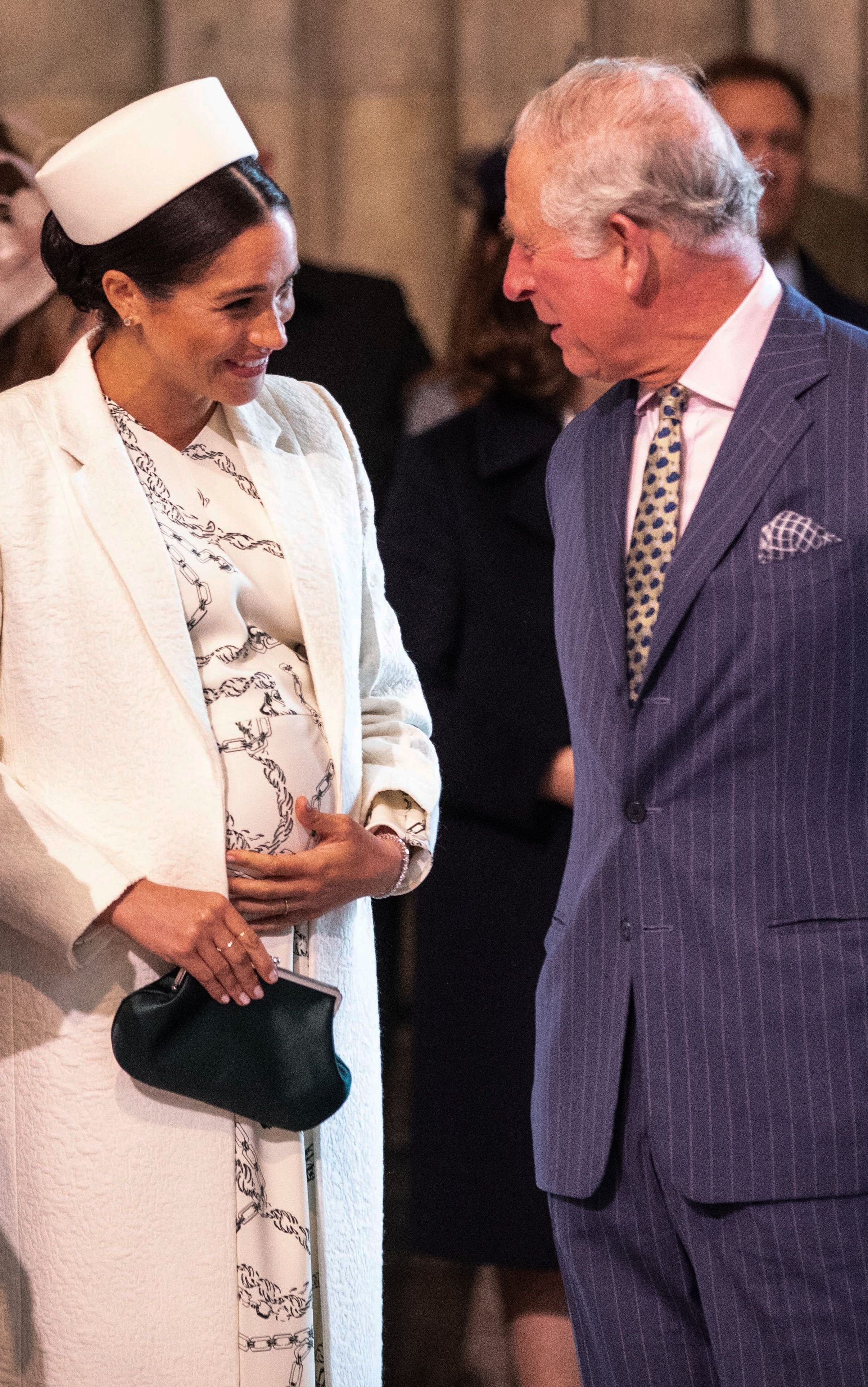 Britain's Meghan, Duchess of Sussex (L) talks with Britain's Prince Charles, Prince of Wales (R) as they attend the Commonwealth Day service at Westminster Abbey in London on March 11, 2019. - Britain | Source: Getty Images