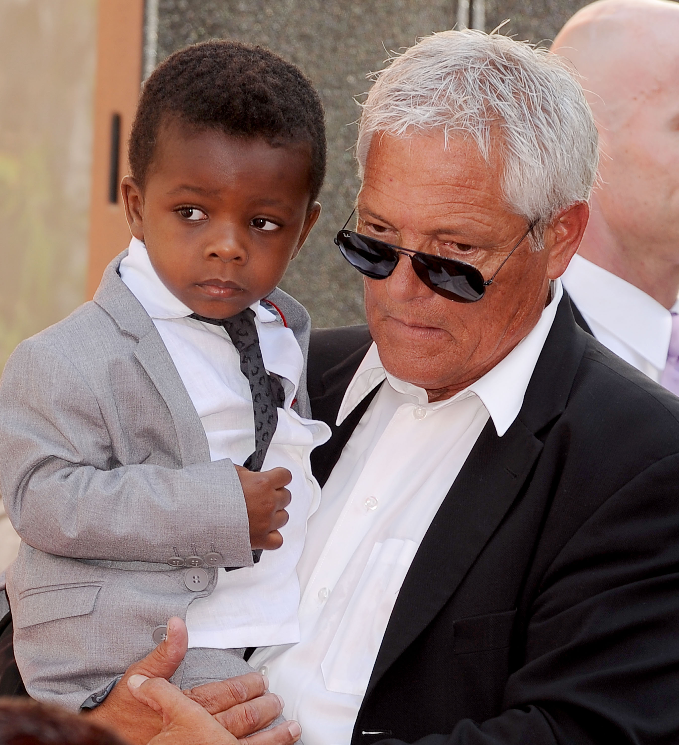 Sandra Bullock's son, Louis, attends his mom's Hand and Footprint Ceremony at TCL Chinese Theatre in Hollywood, California, on September 25, 2013. | Source: Getty Images