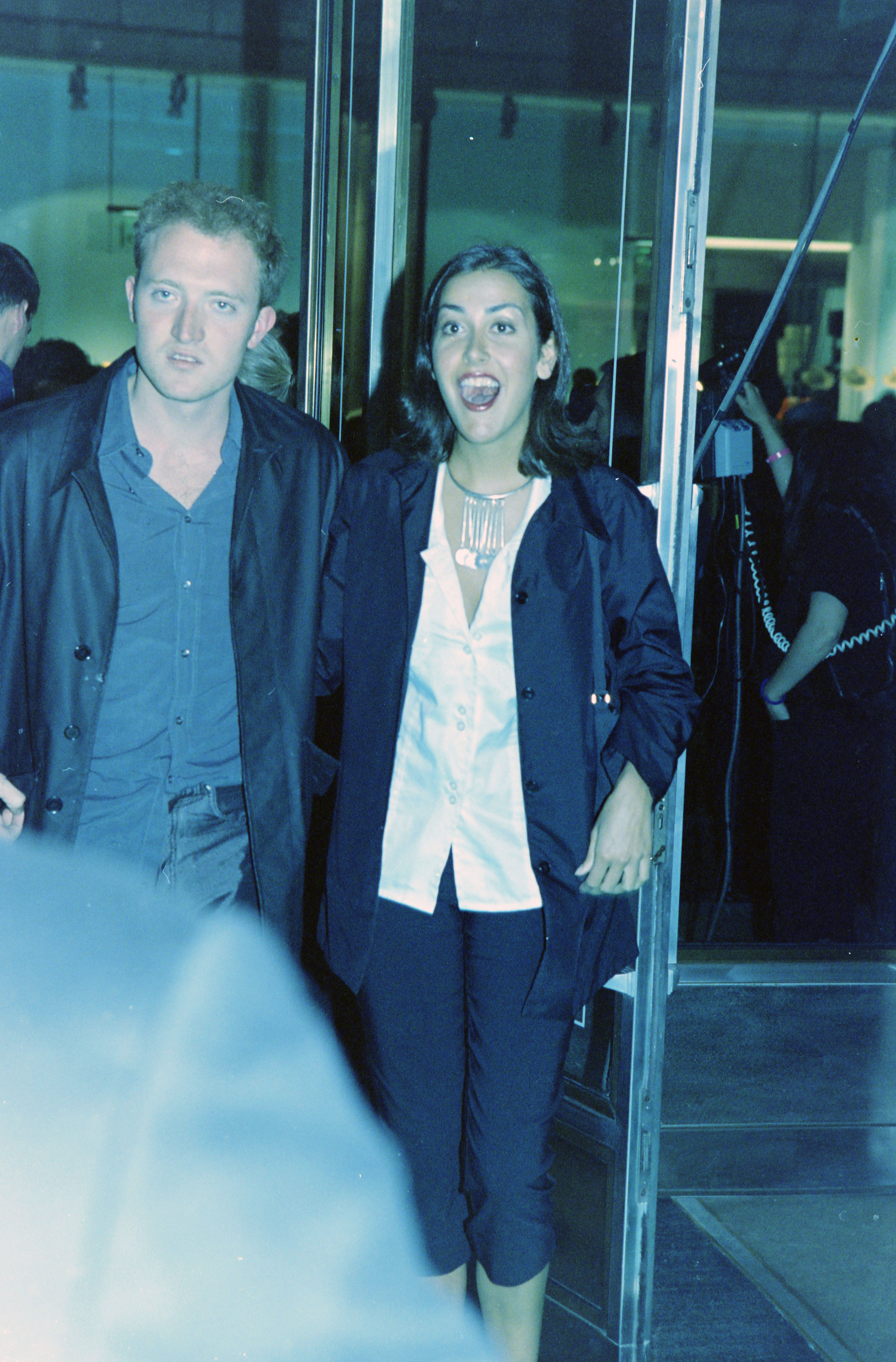 Still at the Versace Jeans Couture party, Natasha Caine was photographed moving through the crowd, chatting and laughing with friends. She appeared relaxed and engaged, taking time to catch up with acquaintances.