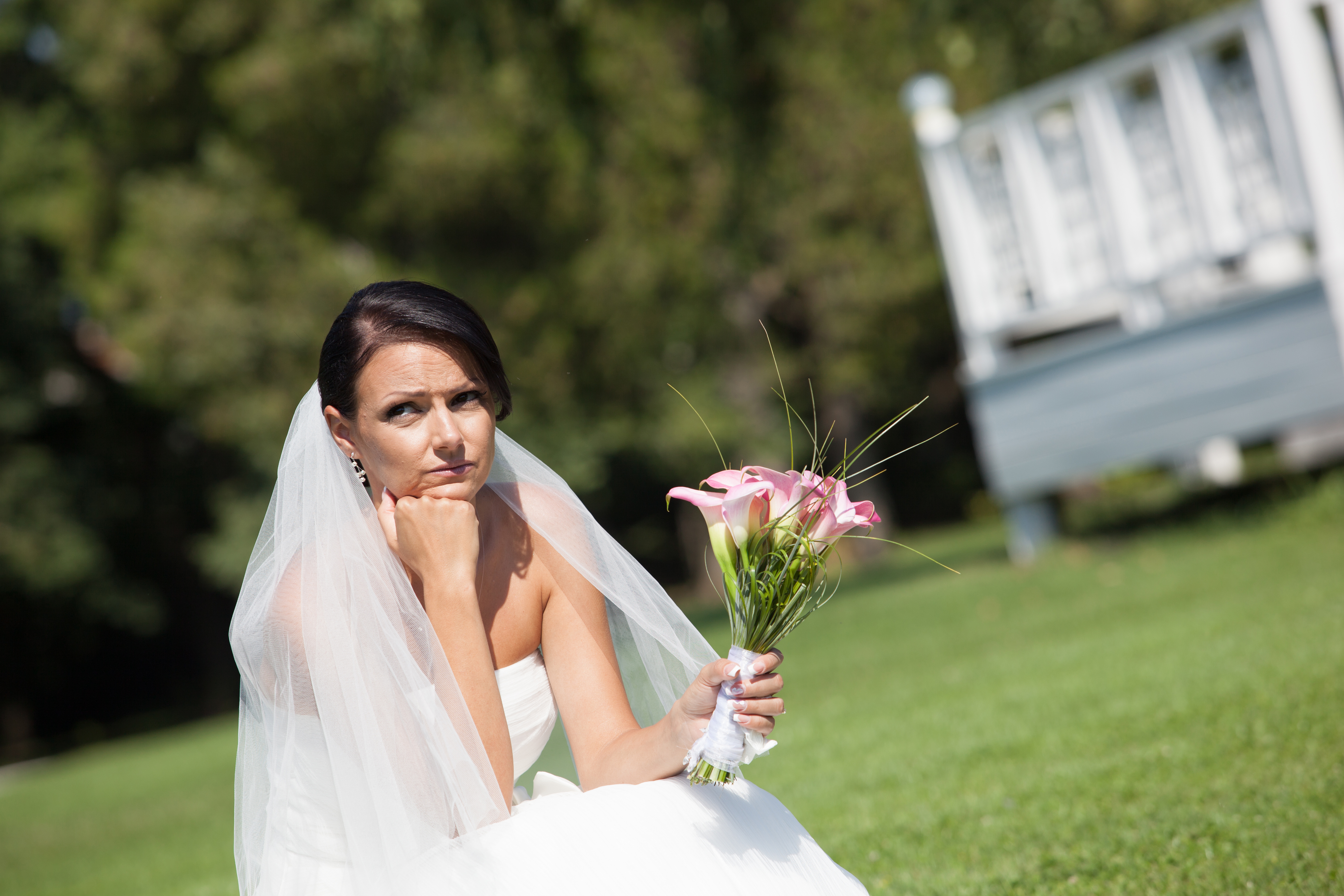 A bride sulking outdoors | Source: Shutterstock