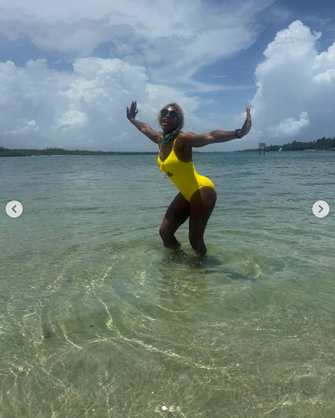 Serena Williams having fun in the water, dressed in her yellow swimsuit. | Source: Instagram/serenawilliams