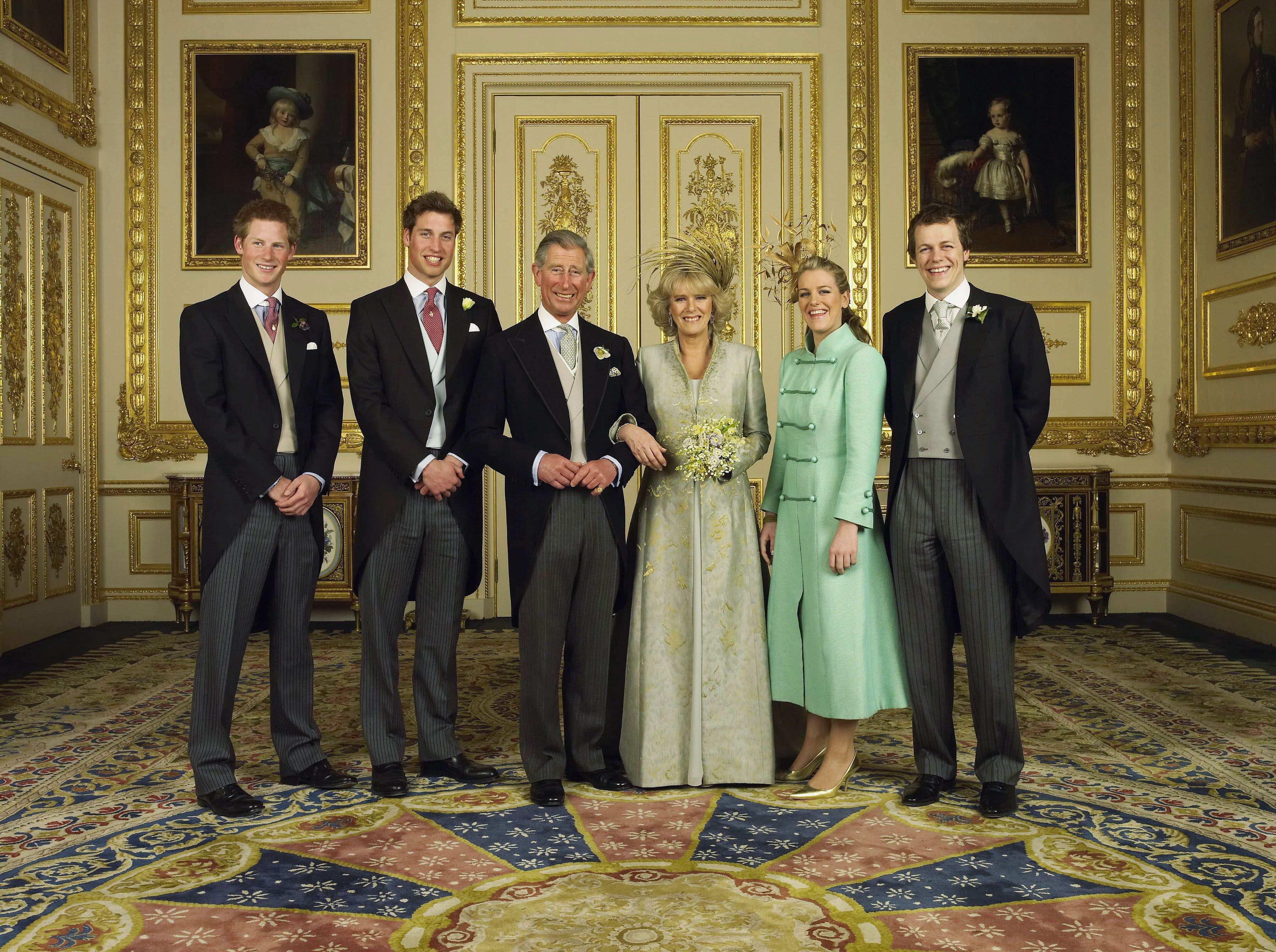 Prince Harry, Prince William, Prince Charles, and his new bride Duchess Camilla, and Laura and Tom Parker Bowles at Windsor Castle after the couple's wedding ceremony on April 9, 2005, in  England. | Source: Hugo Burnand/Pool/Getty Images