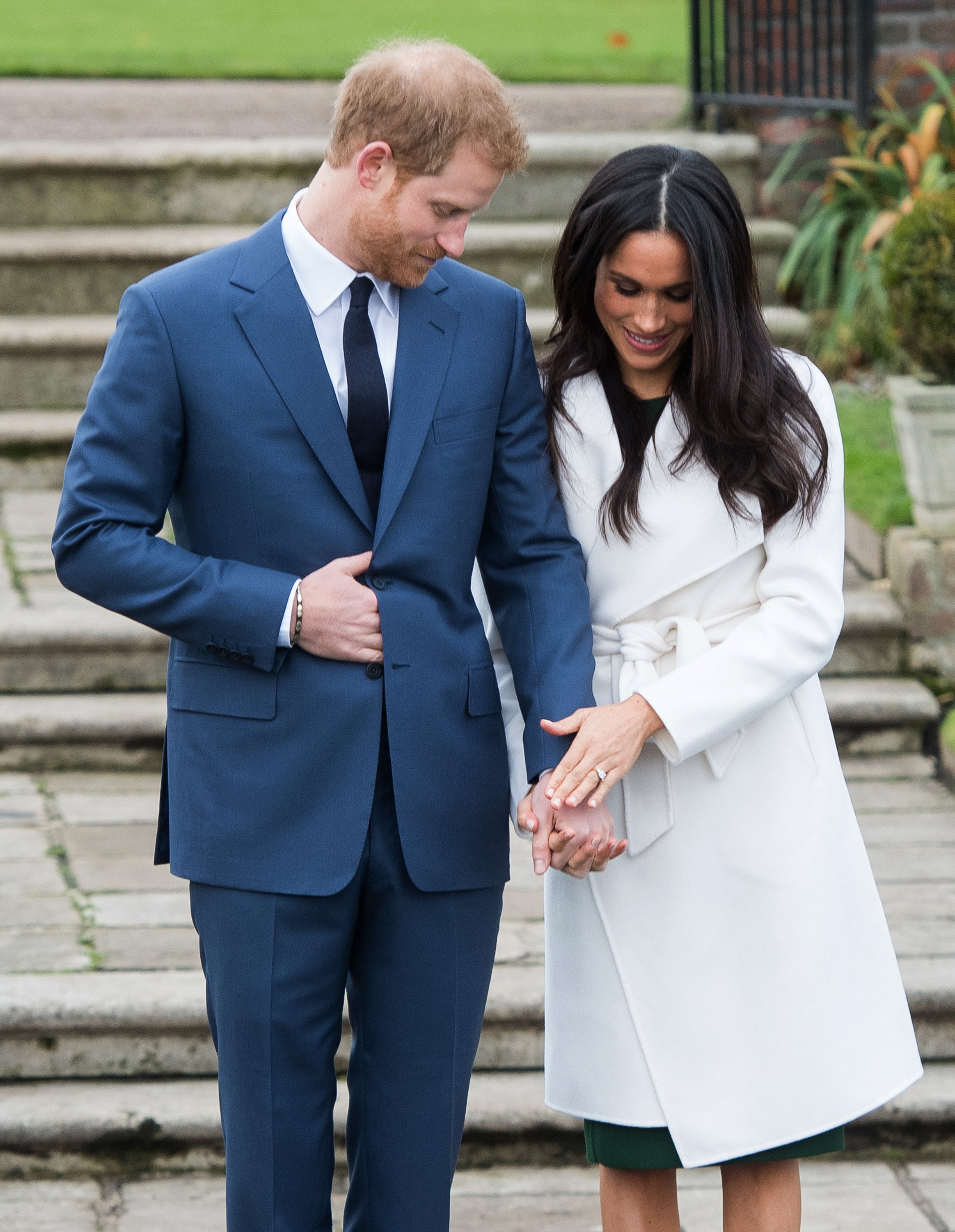 Prince Harry and Meghan Markle at a photocall in the Sunken Gardens at Kensington Palace after the announcement of their engagement on November 27, 2017, in London, England. | Source: Getty Images