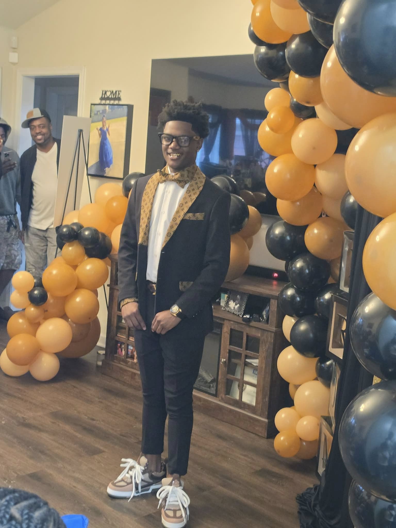 Ladainian Cathey smiling amid balloons. | Source: Facebook/Lakeisha Johnson