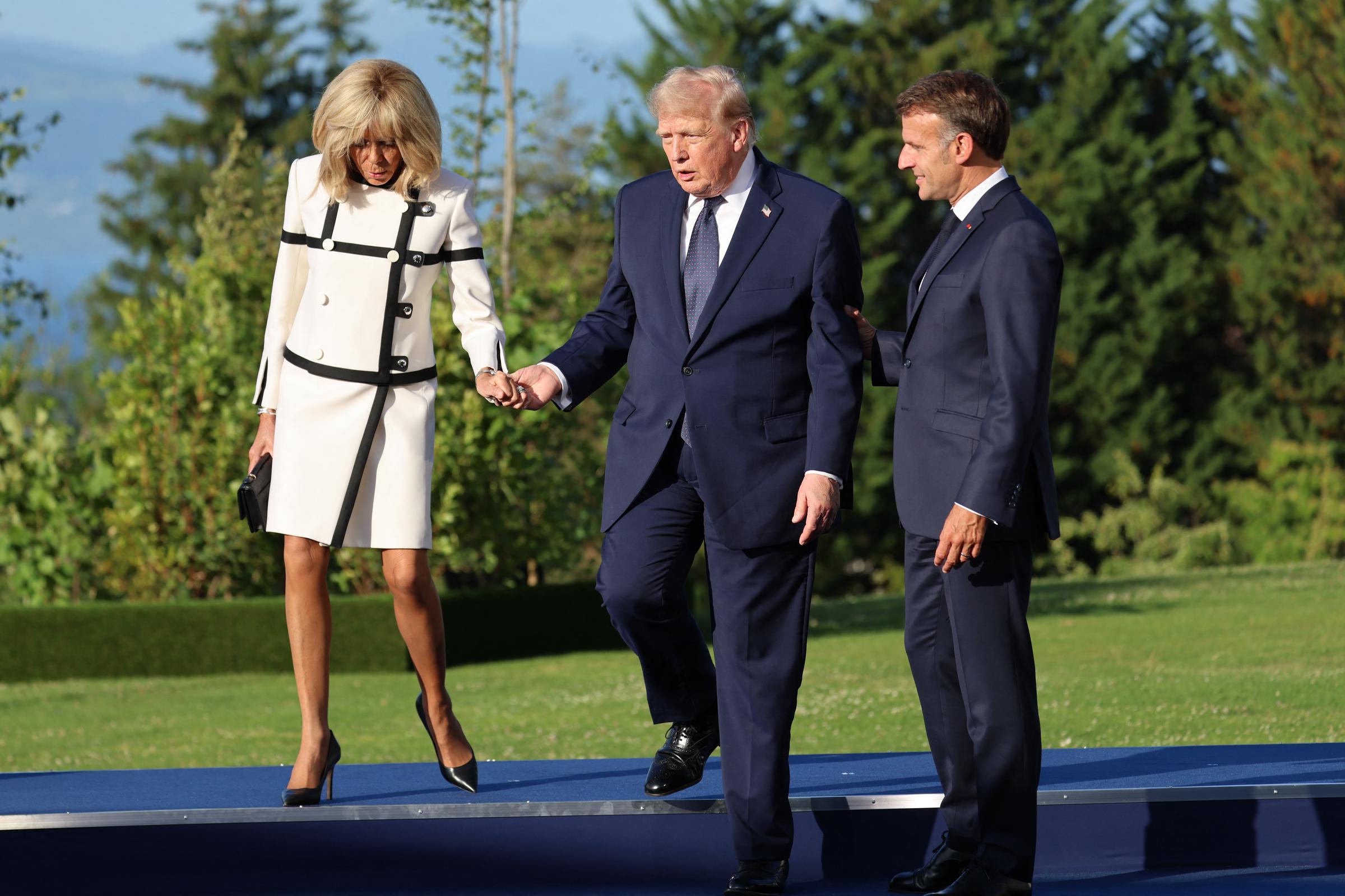 Judi James' interpretation left many wondering whether Emmanuel Macron was simply being courteous — or hoping to become part of the conversation unfolding beside him. | Source: Getty Images