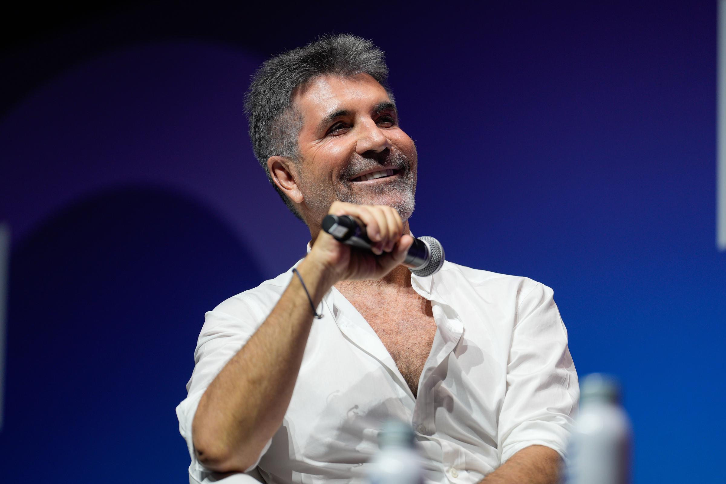 Onstage in Lisbon in June 2025, Cowell addresses the ICON conference with a relaxed smile. Decades into his reign, the once-feared judge reflects on his legacy — the hits, the headlines, the cultural empire he built from scratch.