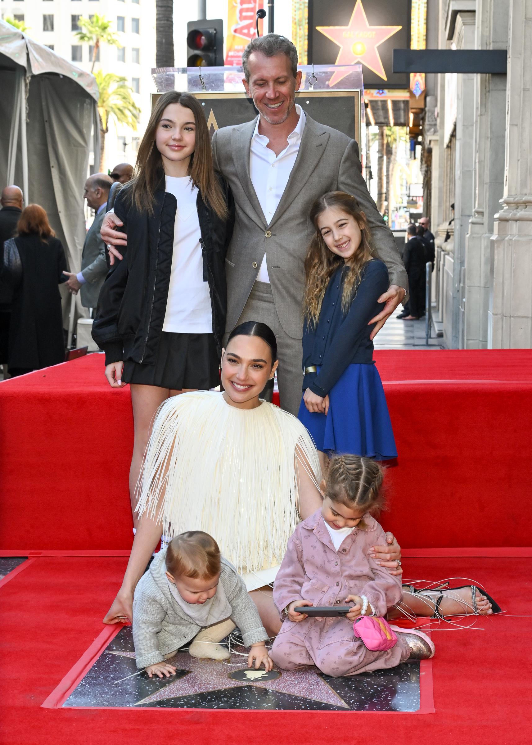 Alma Varsano, Ori Varsano, Jaron Varsano, Maya Varsano, and Daniella Varsano are pictured beside Gal Gadot at the ceremony honoring the actress with a Star on the Hollywood Walk Of Fame on March 18, 2025, in Hollywood, California | Source: Getty Images