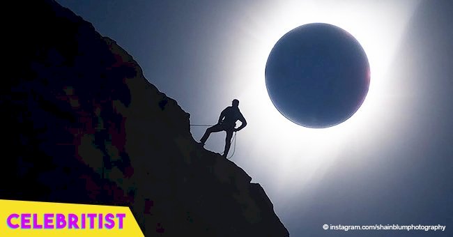 Photo of a rock climber posing in front of a total solar eclipse has gone viral