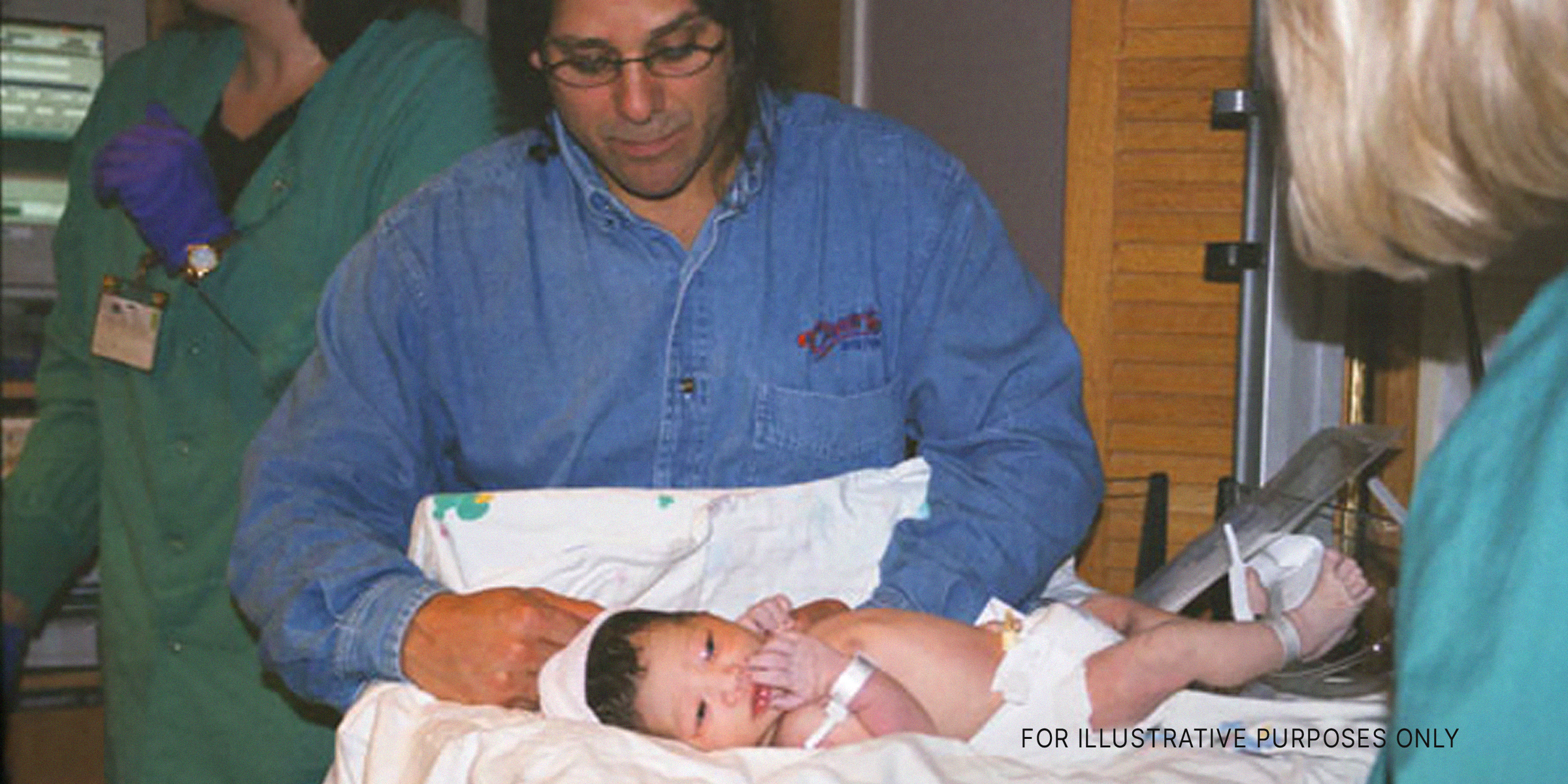 A Man Looking At His Newborn Baby | Source: Flickr.com/photos/jbach