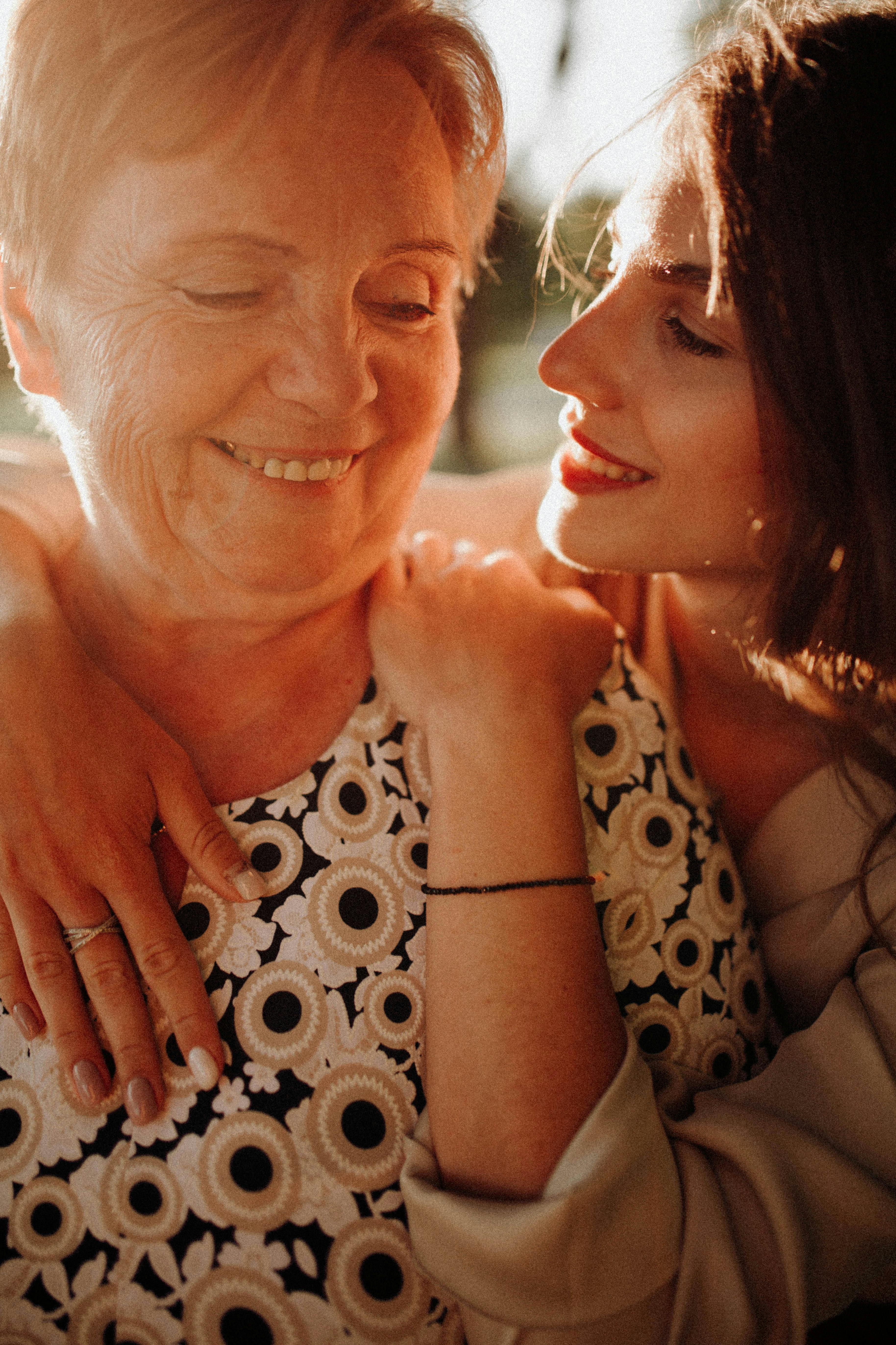 A mom and daughter duo looking at one another lovingly | Source: Pexels