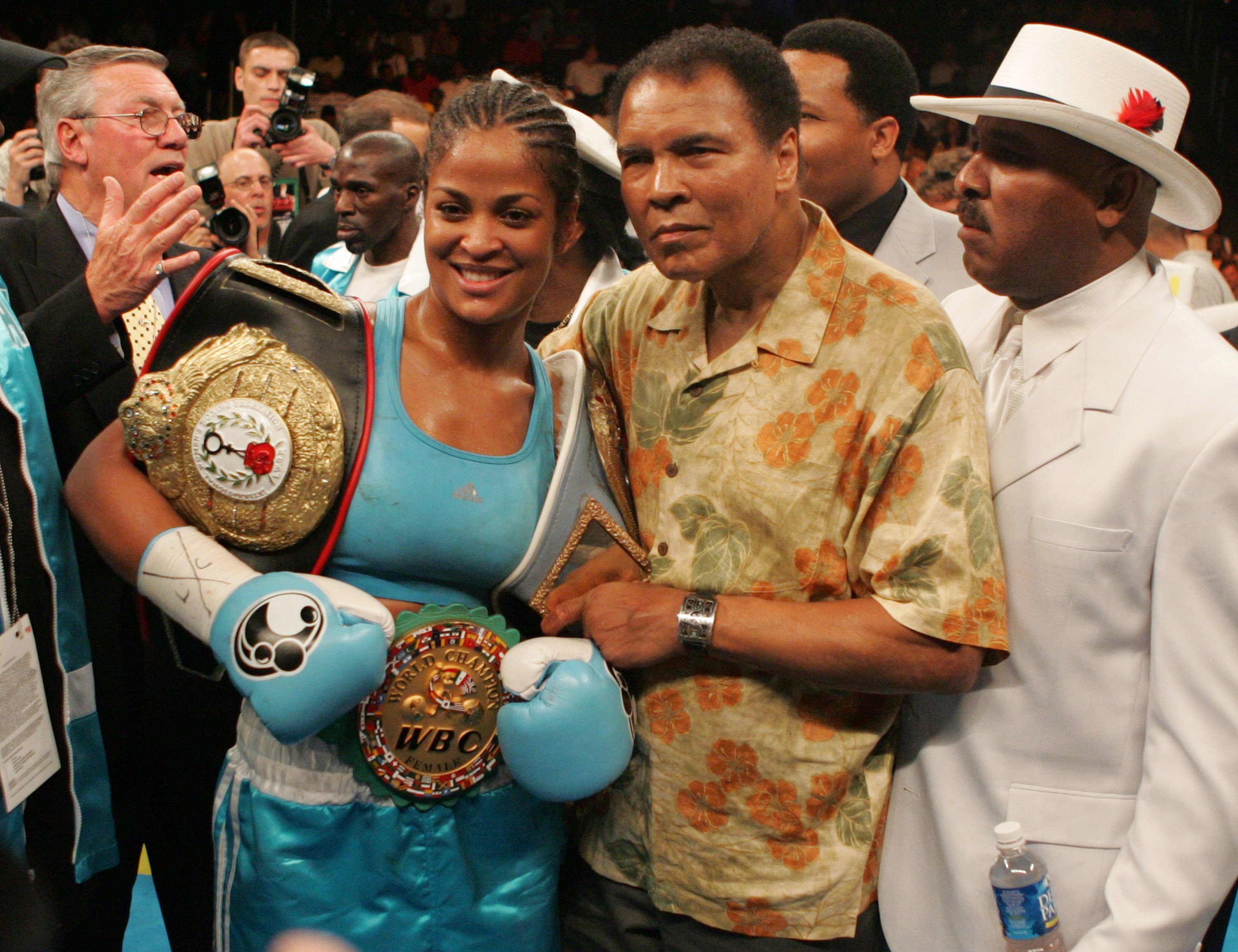 Laila Ali and her father, Muhammad Ali after her 10-round WBC/WBA Super Middleweight title win against Erin Toughill in June 2005. | Photo: Getty Images
