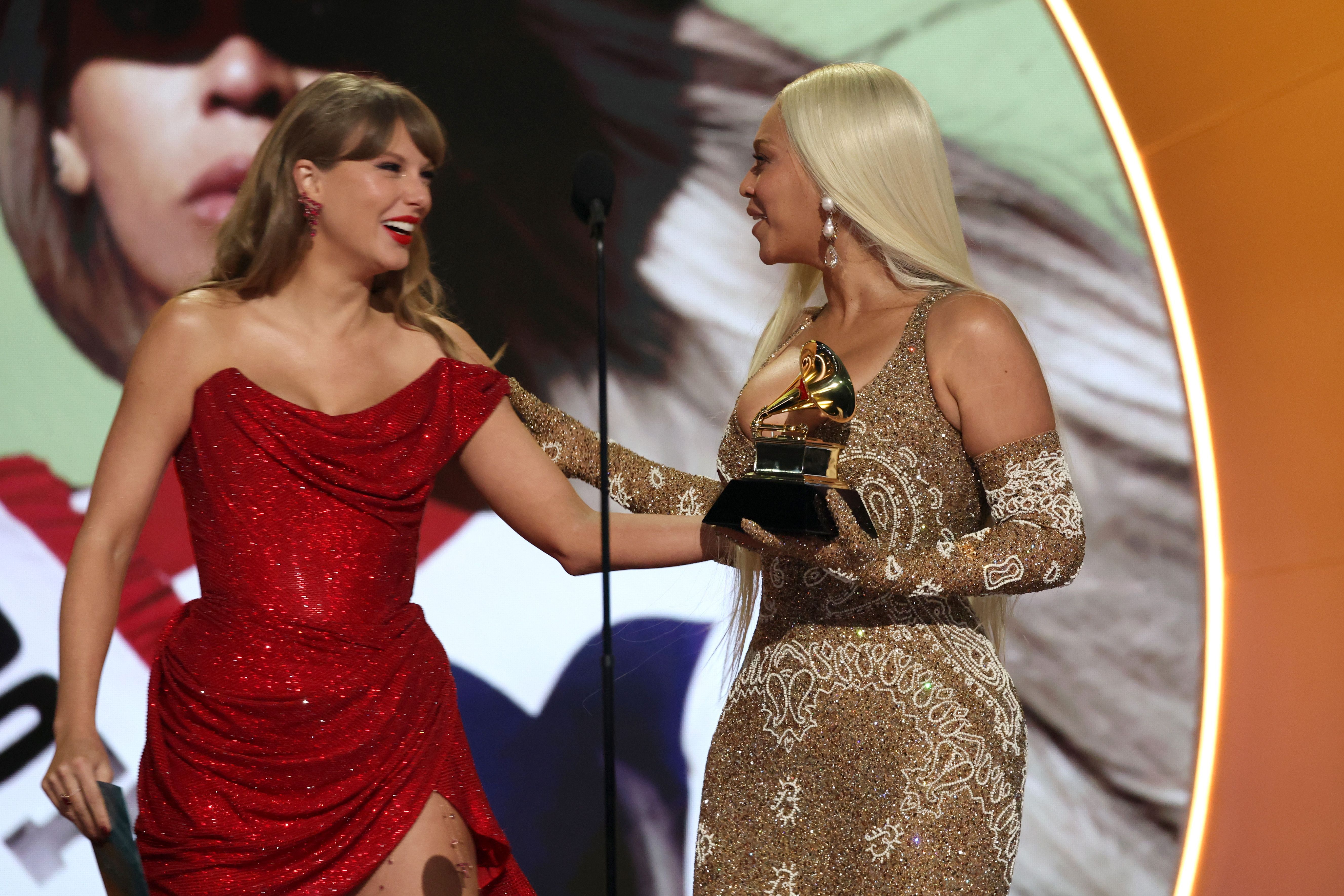 Taylor Swift presents Beyoncé with the Best Country Album award for "Cowboy Carter" onstage during the 67th Annual Grammy Awards in Los Angeles, California | Source: Getty Images