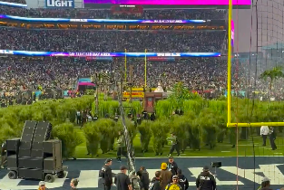 A view of the people in grass costumes running to their positions on the field during the 2026 Super Bowl, posted on February 9, 2026. | Source: X/@LudwigAhgren