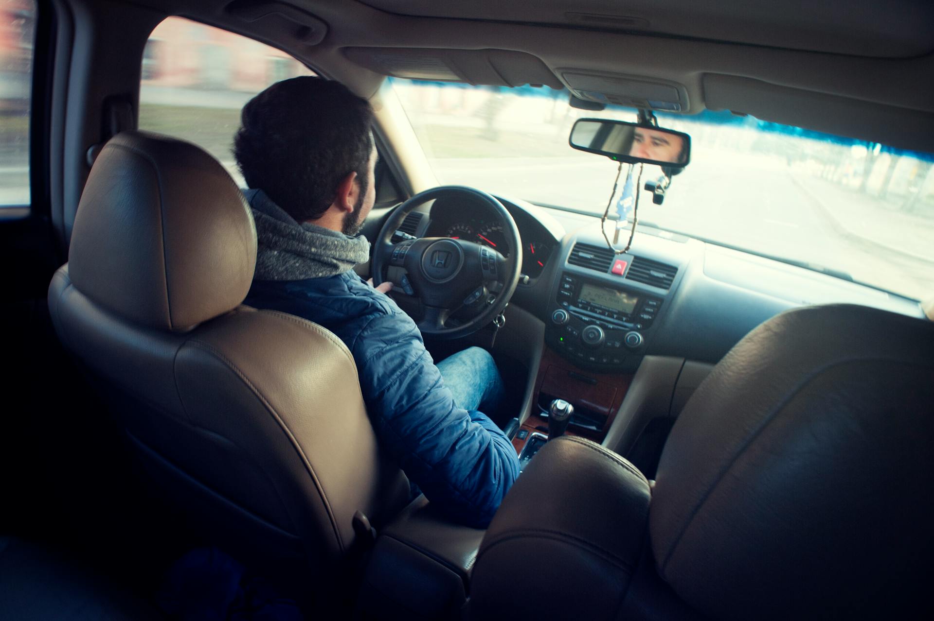 A man sitting in his car | Source: Pexels