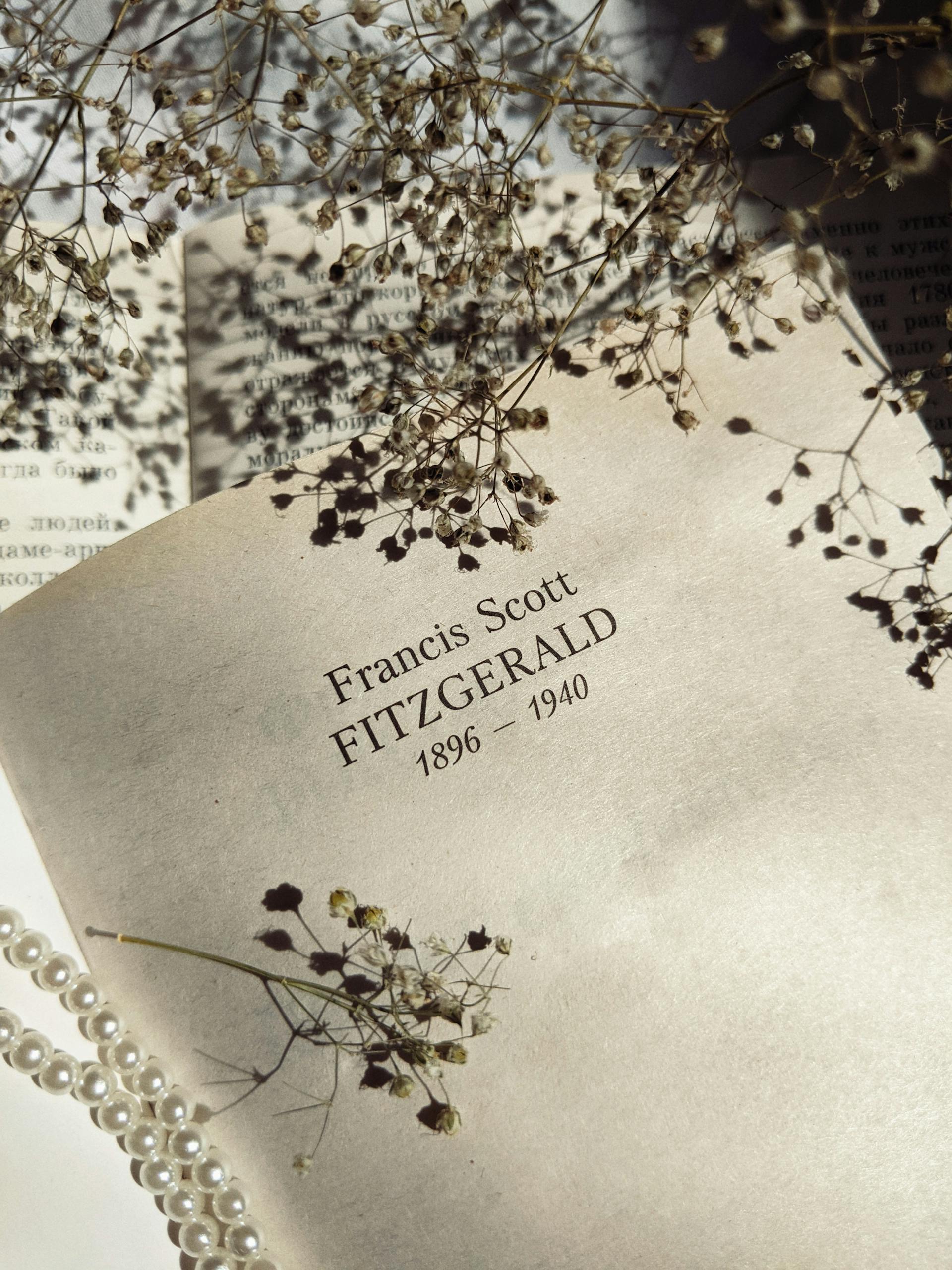 The name "Francis Scott Fitzgerald" written on a book's page | Source: Pexels