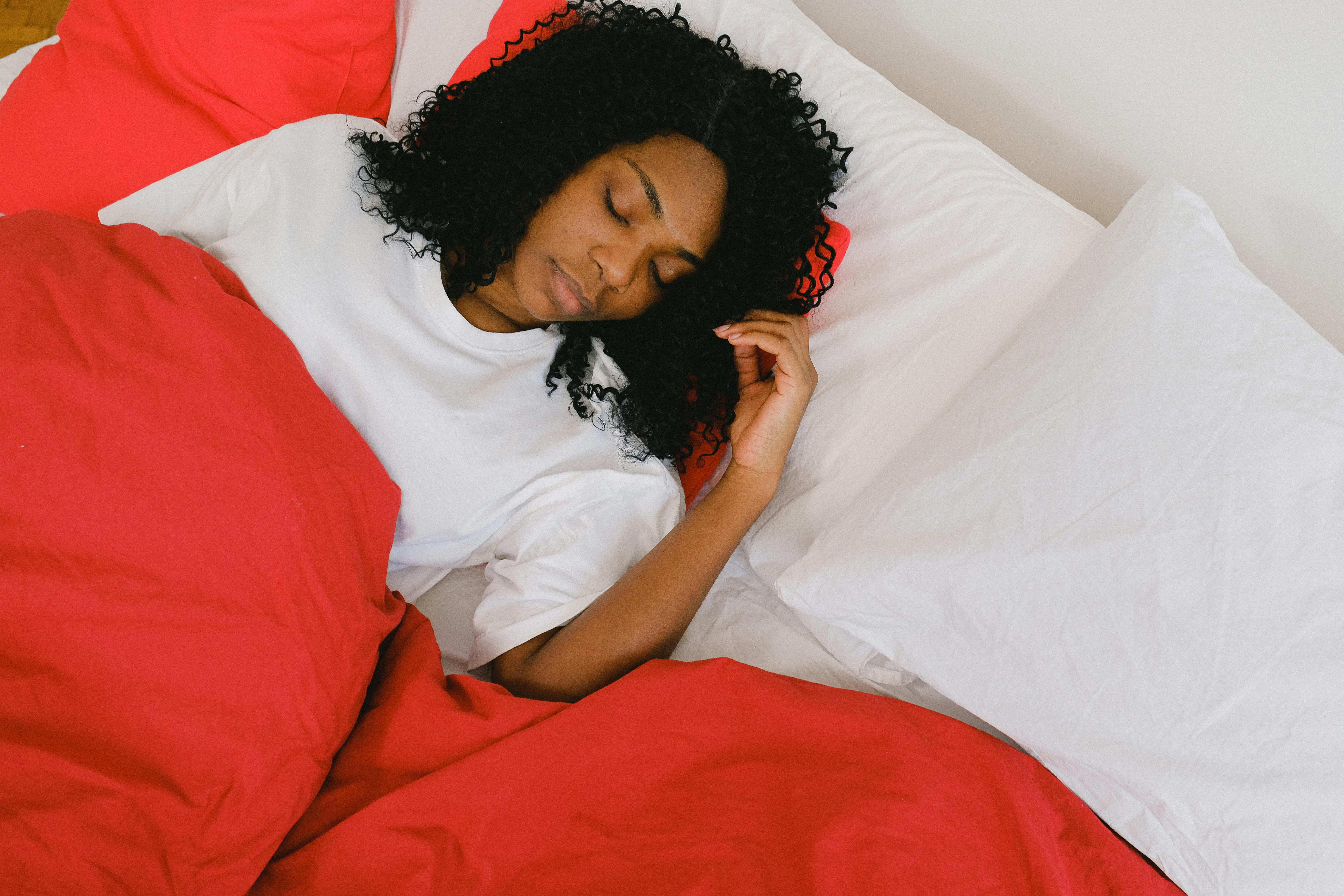 A woman asleep in bed | Source: Pexels