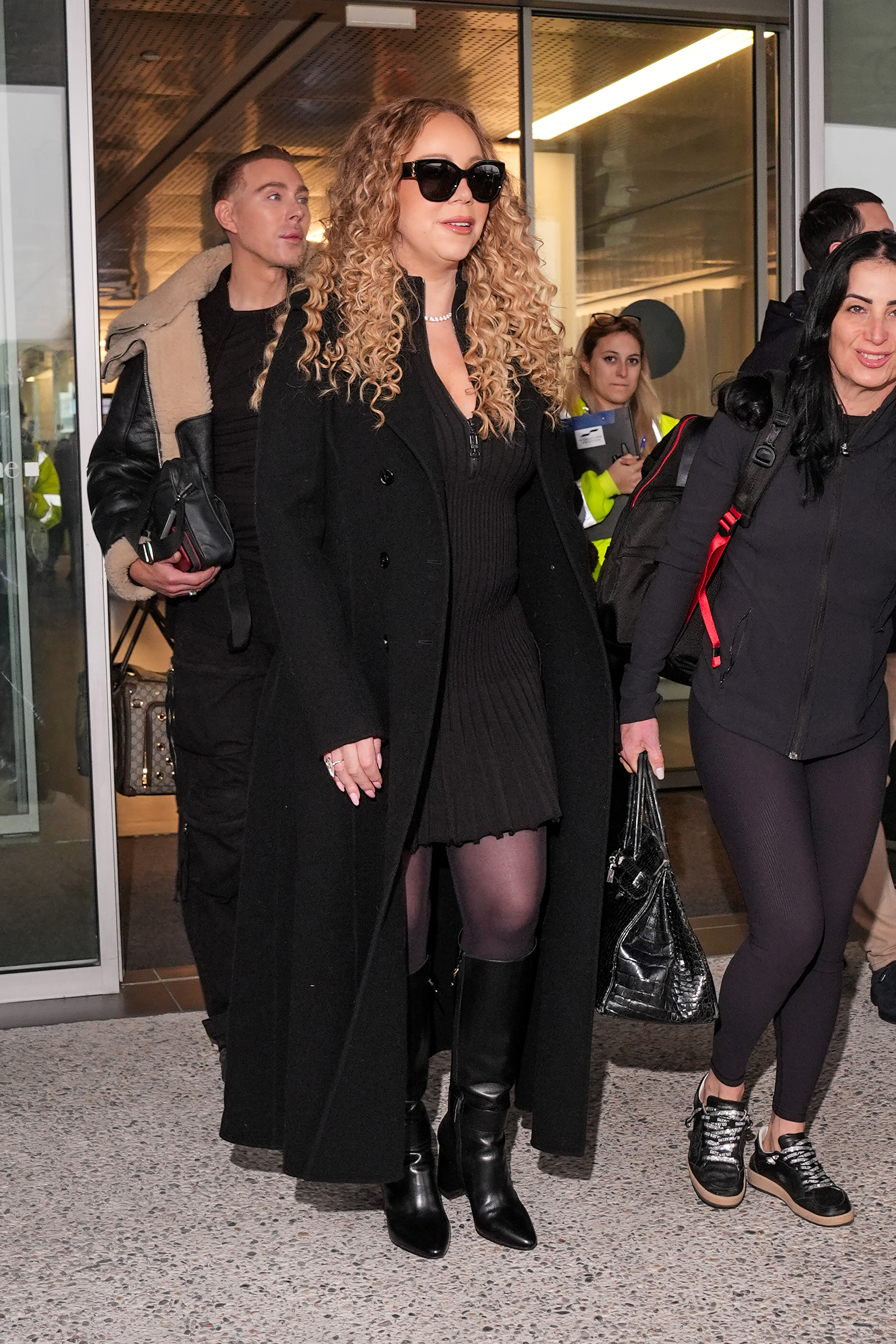 Mariah Carey arrives at the airport ahead of the Winter Olympic Games on February 2, 2026, in Milan, Italy | Source: Getty Images