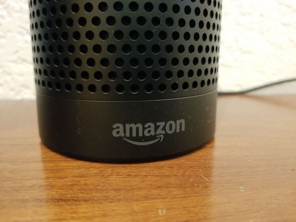 Close-up of the base of an Amazon Echo smart speaker using the Alexa service, with Amazon logo visible. | Photo: Getty Images
