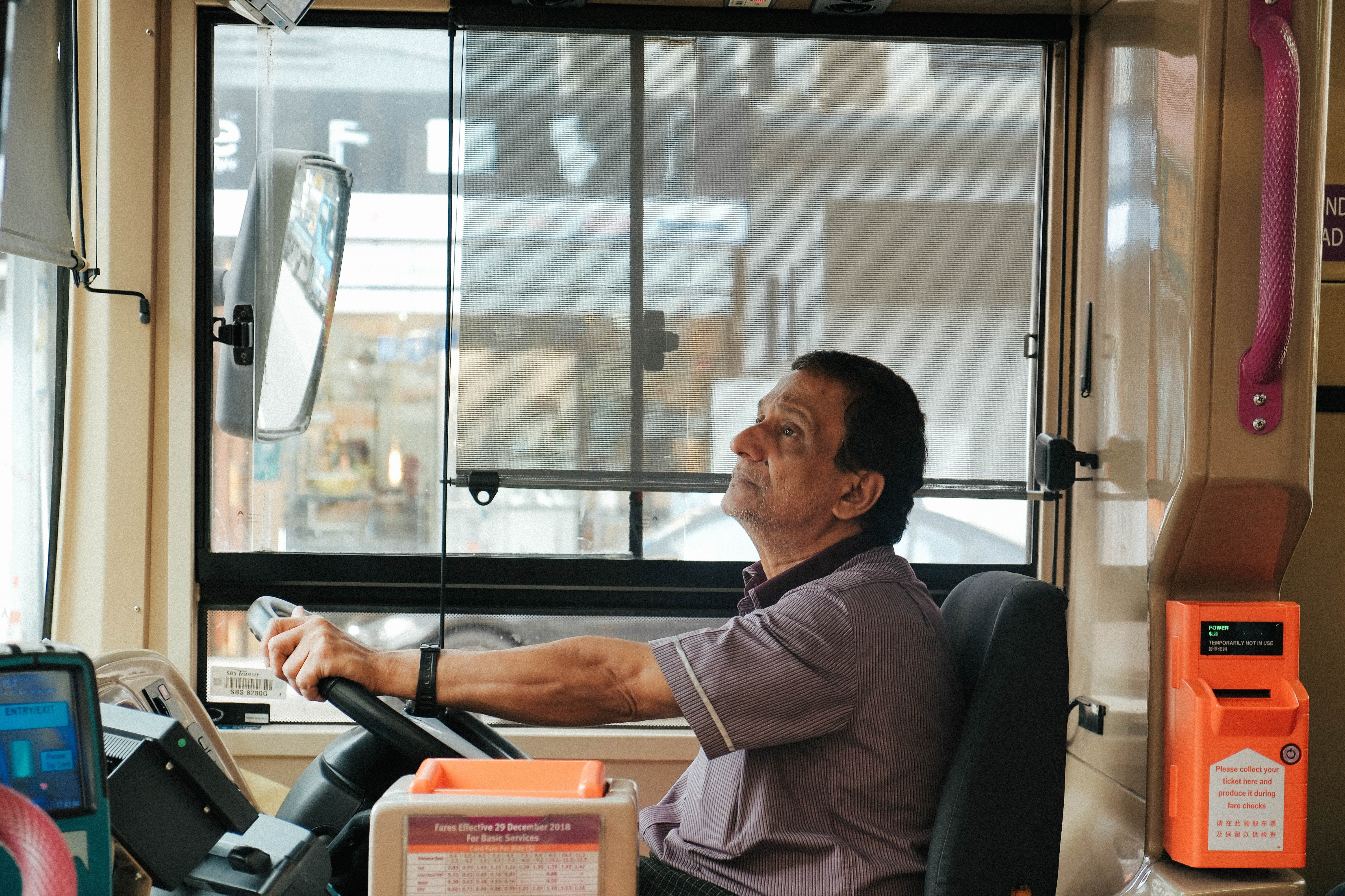 Larry announced that they were at the final bus stop but got no response from the man sleeping  | Source: Pexels