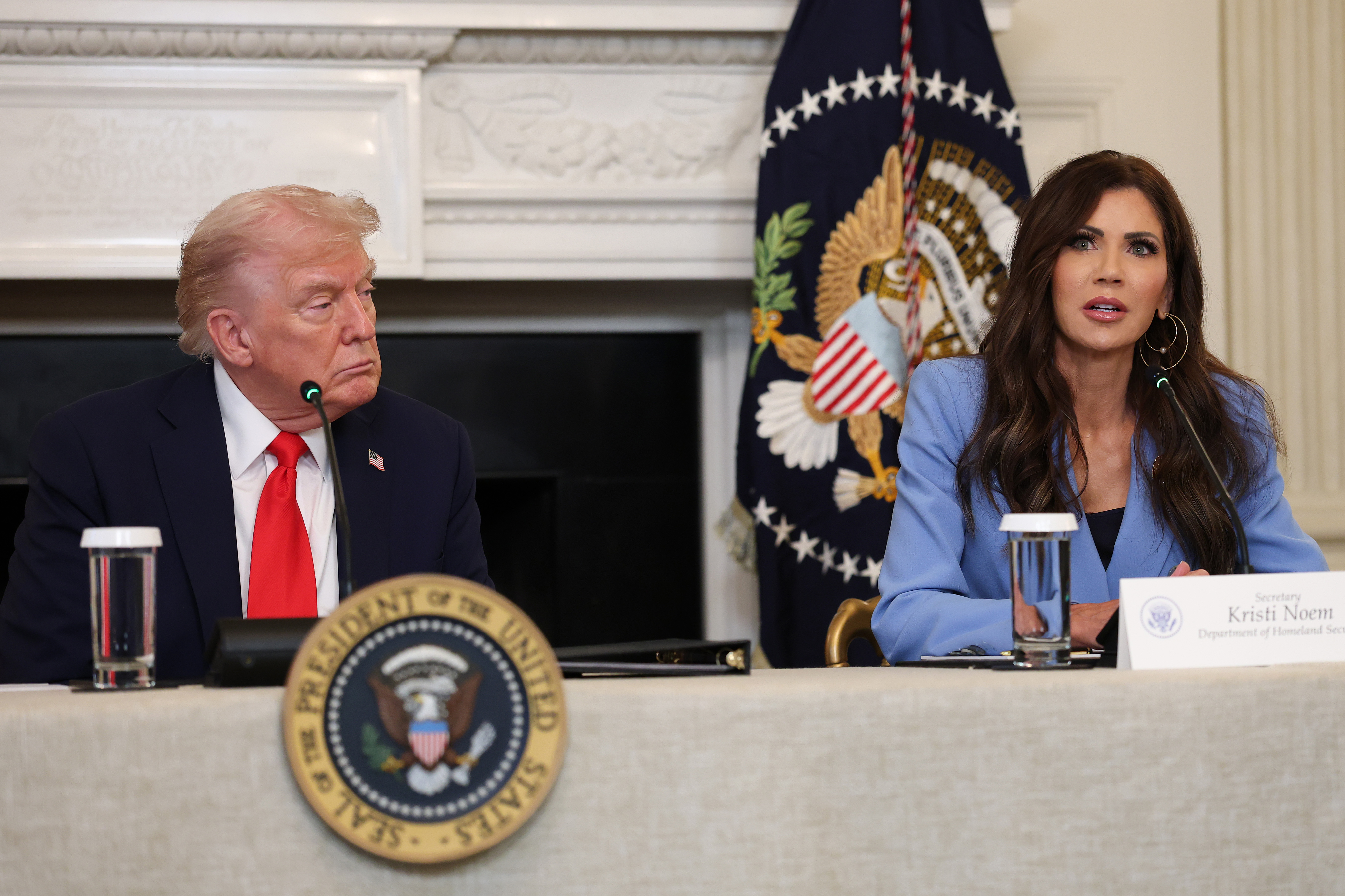 Donald Trump and Kristi Noem during a roundtable discussion in the State Dining Room of the White House in Washington, D.C., on October 8, 2025 | Source: Getty Images