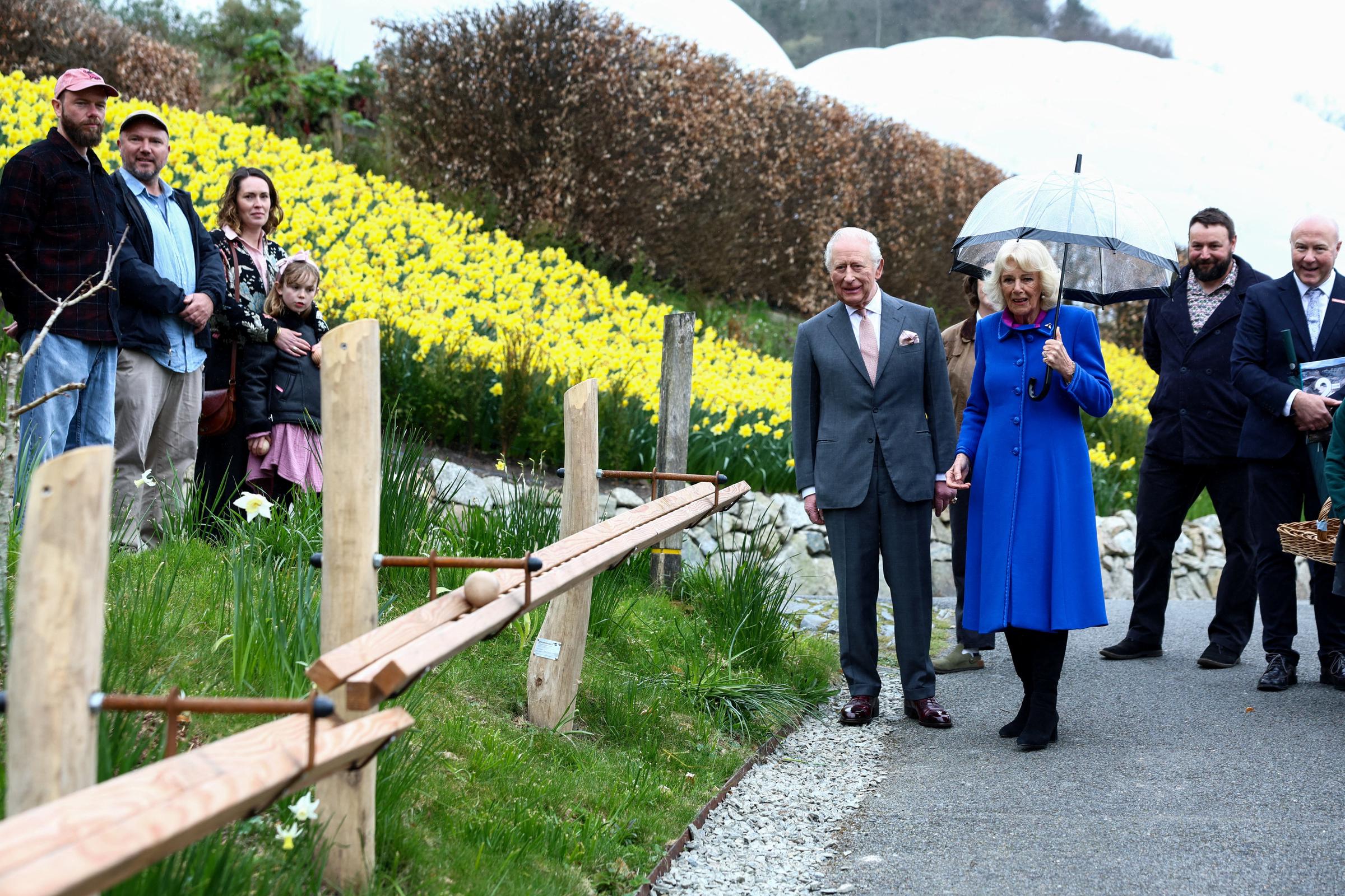 King Charles III and Queen Camilla view a section of a new marble run created for visitors from over 100 metres of handcrafted wooden track at The Eden Project during an event to mark its 25th anniversary on 24 March 2026 in St Austell, England. | Source: Getty Images