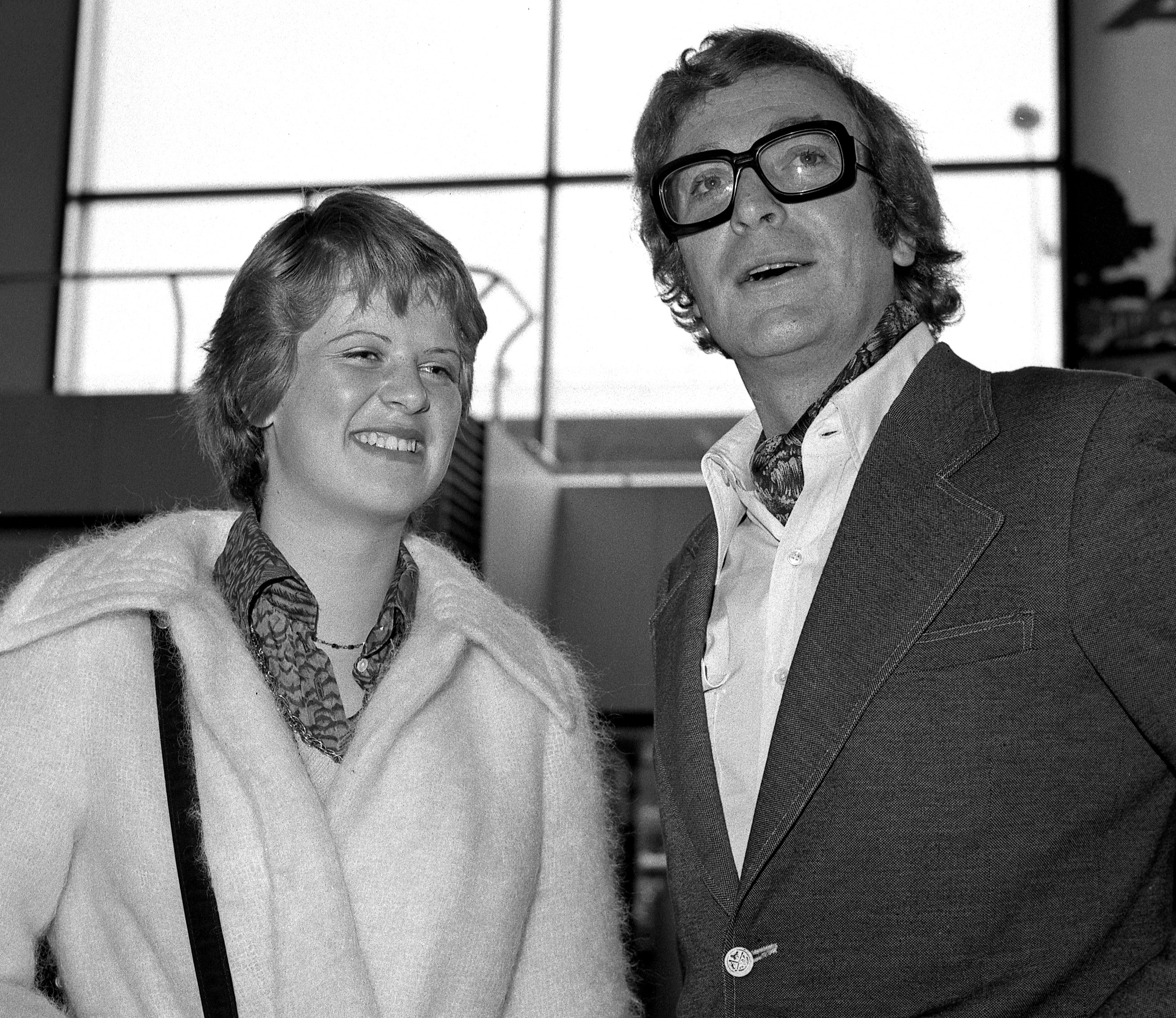 Michael Caine and 15 year-old Dominique Caine leave for Los Angeles on March 20, 1973. | Source: Getty Images