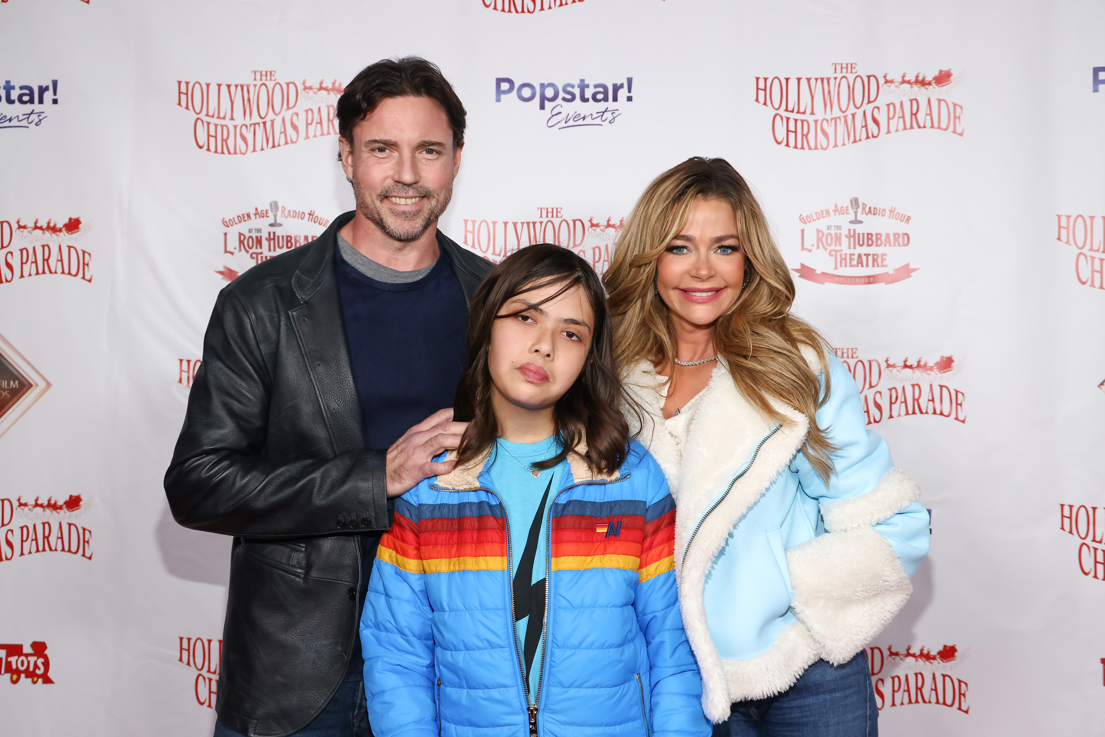 Aaron Phypers, Eloise Joni Richards and Denise Richards attend the 91st anniversary of the Hollywood Christmas Parade, supporting Marine Toys For Tots on November 26, 2023 in Hollywood, California. | Source: Getty Images