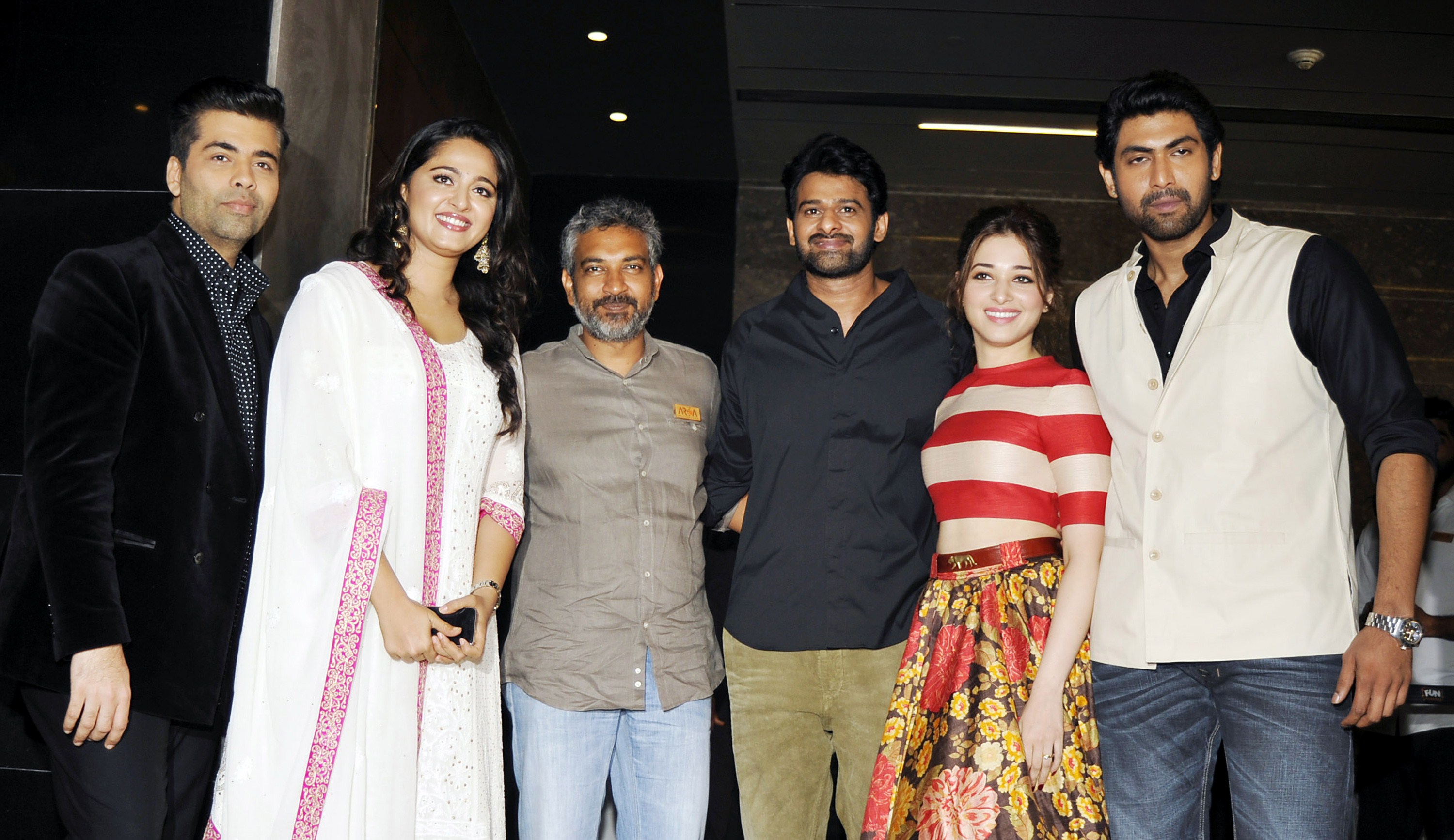 (L-R) producer Karan Johar, actress Anushka Shetty, writer and director S. S. Rajamouli, and actors Prabhas, Tamannaah Bhatia and Rana Daggubati at the launch of the trailer of their film "Baahubali" in Mumbai on June 1, 2015. | Source: Getty Images