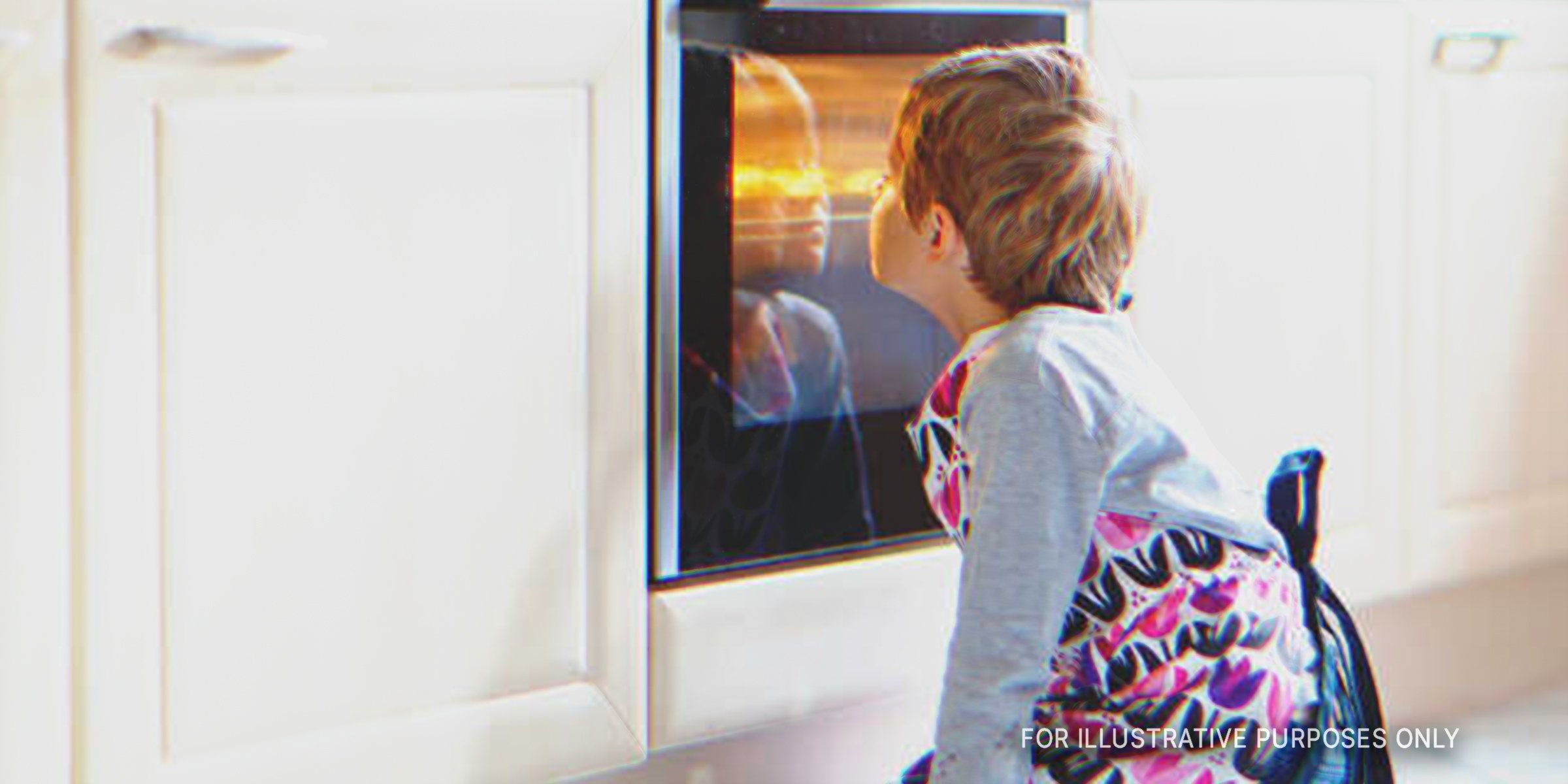 Boy looking at an oven | Source: Shutterstock