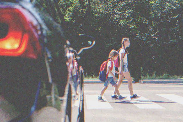 Kids crossing the road | Source: Shutterstock