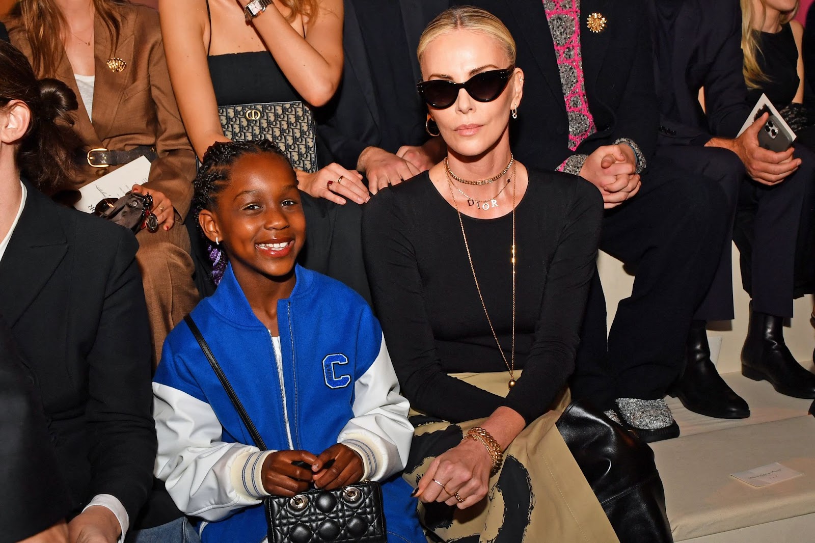 Charlize Theron with her daughter at the Dior pre-fall fashion show on April 15, 2024, in New York. | Source: Getty Images